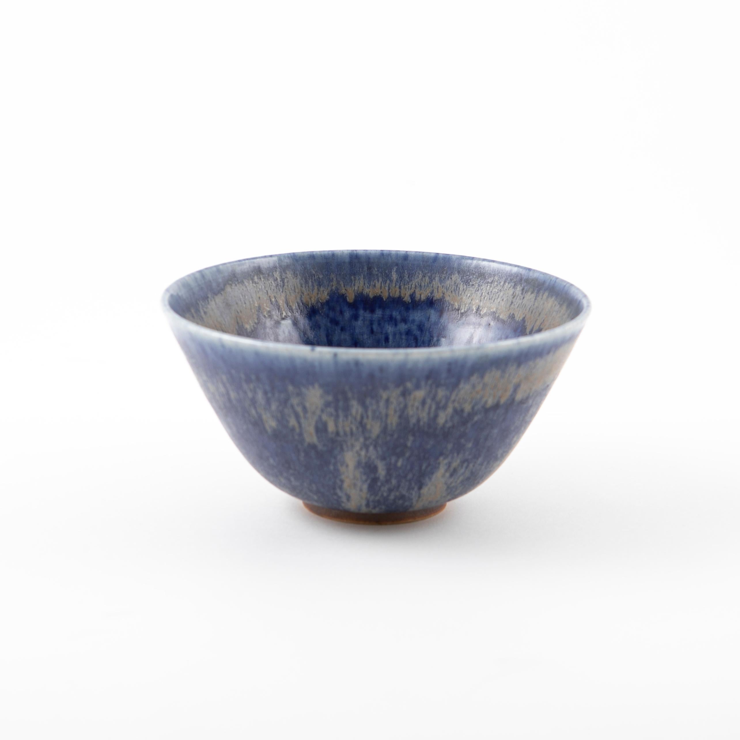 Danish midcentury ceramic bowl from the legendary workshop Saxbo, made circa 1950s.
Made in stoneware with a blue and grey-brown glaze.
Marked Saxbo 3 IV.

The bowl is 8 cm heigh and 15 cm in diameter - in mint condition.