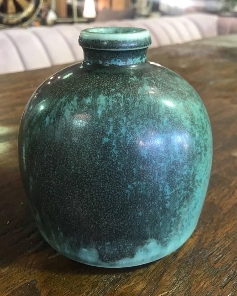 Fantastic piece in impeccable condition by famed Danish designer/ceramist Eva Staehr Nielsen. This piece features her iconic dripped bluish, green glaze and is marked 