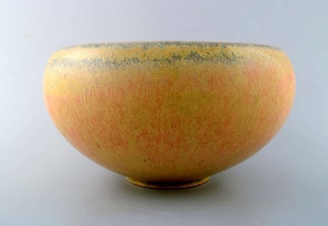 Saxbo. Stoneware bowl in modern design, glaze in yellow shades.
Stamped Saxbo. Ying Yang, Model Number 94.
Measures 25 x 14 cm.
In perfect condition.
1st. assortment.
