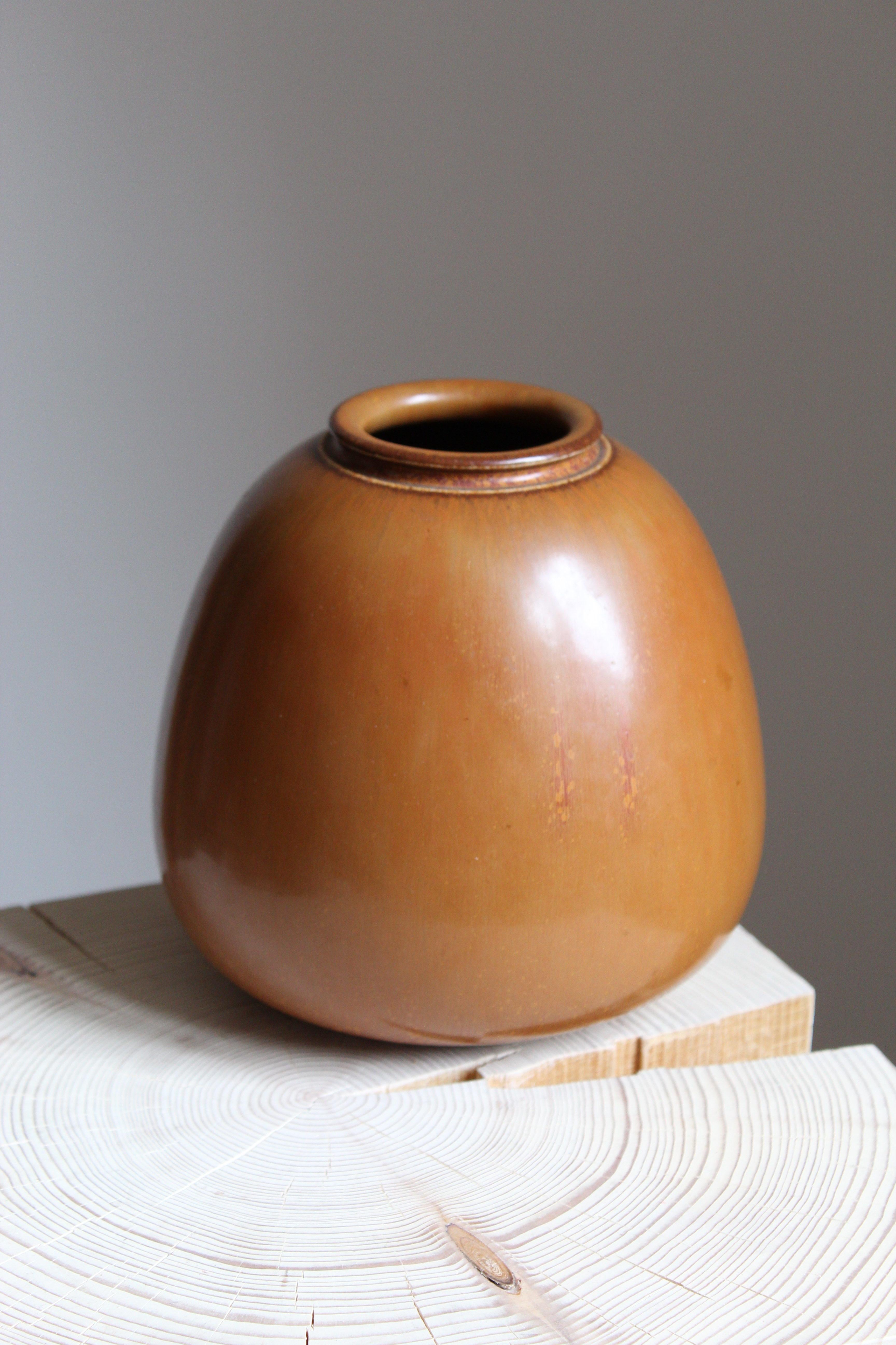 A vase, produced by Saxbo, Denmark, 1950s. Possibly designed by Eva Stæhr-Nielsen

Other designers of the period include Gunnar Nylund, Axel Salto, Carl-Harry Stålhane, Wilhelm Kåge, and Arne Bang.