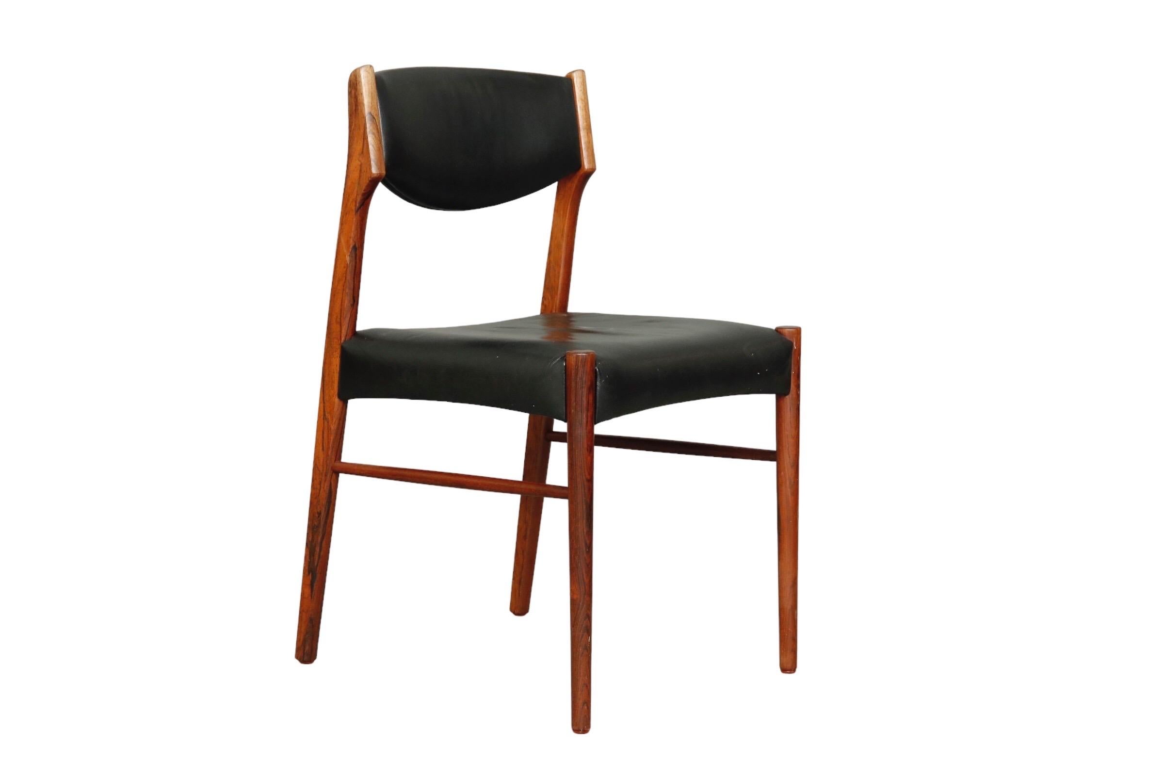 Set of six Saxkjobing Savvaerk Stolefabrik (SAX) mid century dining chairs made of rosewood. Clean lines throughout, the square seat and back upholstered in a black faux leather. Made in Denmark in the 1960s.

Measures: W:18”
D:18”
H:31” 
Seat
