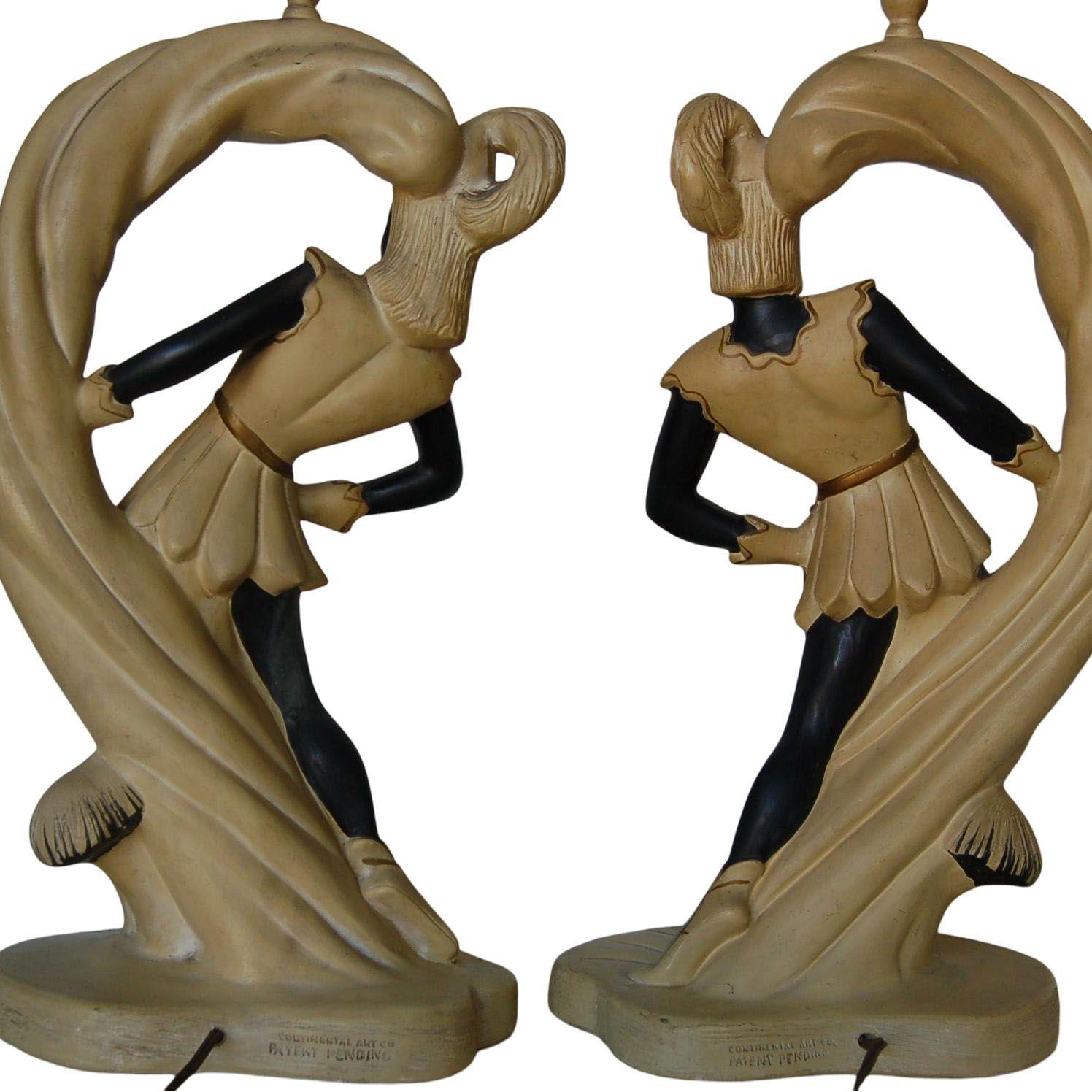 Pair of midcentury Saxon crusader Robin Hood wood nymph themed chalkware figural table lamps. Made by Continental Art Company. 

Measures 10