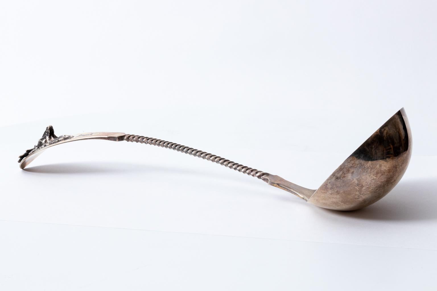 Masterfully crafted saxon stag ladle by Gorham, circa early 20th century. Made for Tiffany and Company. This sterling silver ladle is monogrammed with 3d applied figural stag with great detail and a twisted handle leading to the bowl. It weighs 7.31