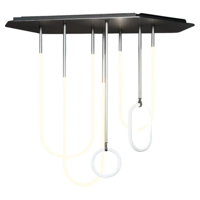 Made in Italy.

Neon hanging lamp with warm, grey-varnished satin-coated aluminum structure. Grey-varnished satin-coated brass tubes. Decorative rings in matte Bianco Gioia marble. River Congo leather laces. Light sources with white color Warm Tone