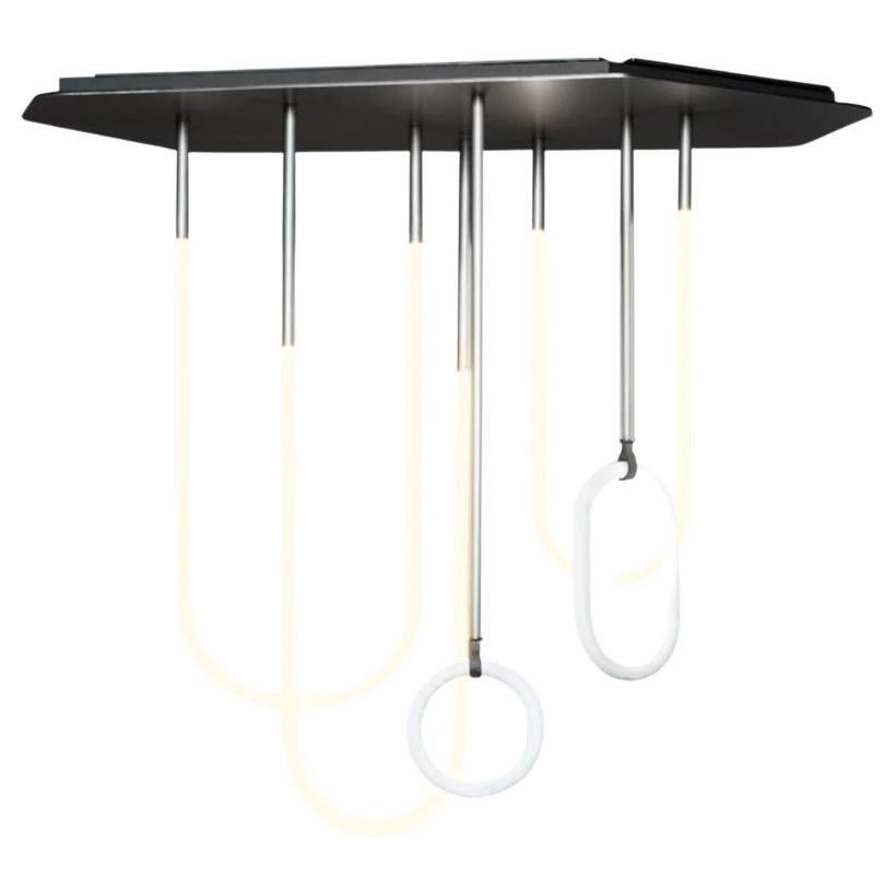 Prodotto in Italia.

Designer: Studiopepe

Lampada a sospensione al neon con struttura in alluminio satinato verniciato grigio caldo. Tubi in ottone satinato verniciato grigio. Anelli decorativi in marmo Bianco Gioia opaco. Lacci in pelle River