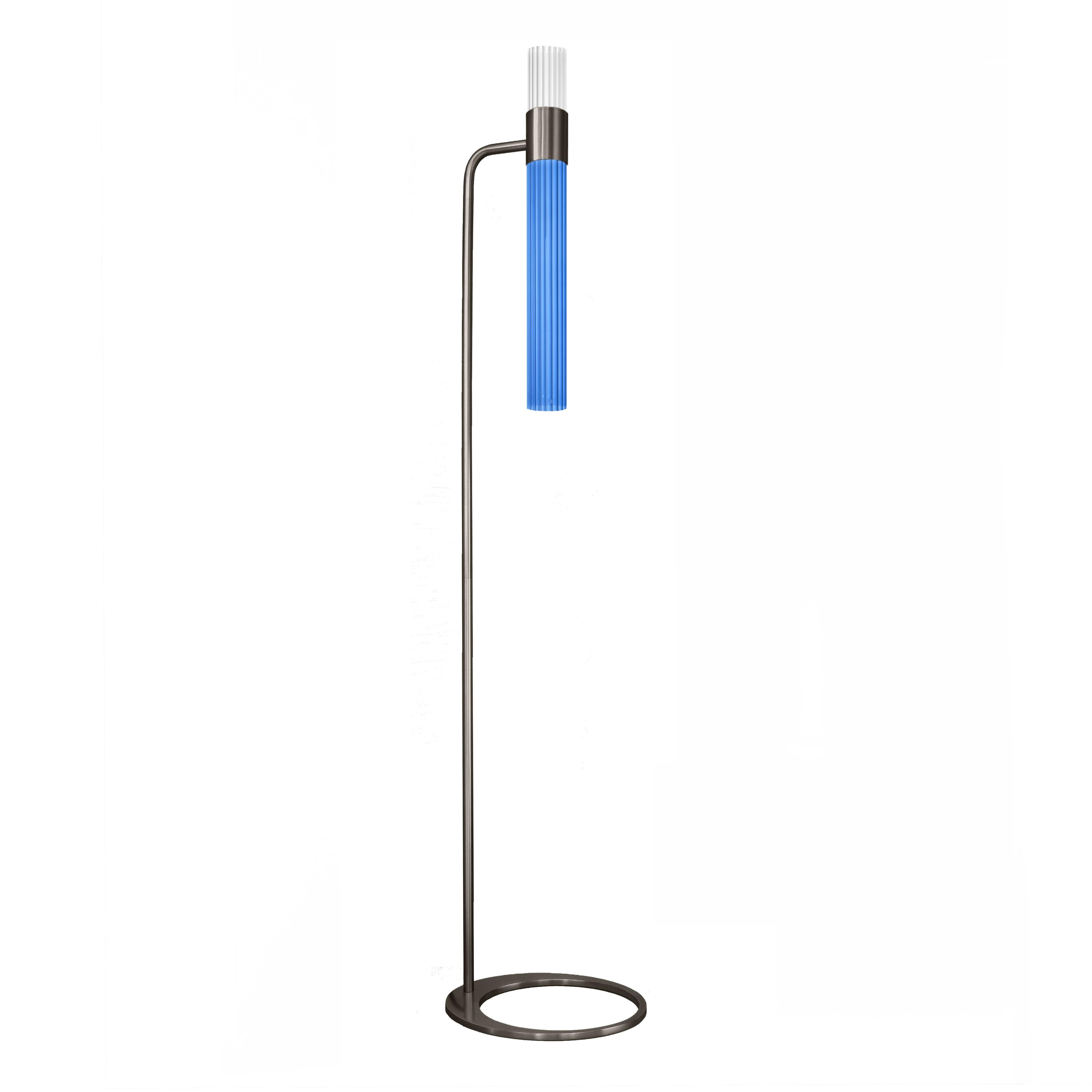 Sbarlusc floor lamp by LUCE TU.
Dimensions: 149 x 32.5 cm
Materials: Brass and glass

Sbarlusc in Milanese dialect represents the sparkle of a precious and very bright object. The colored glasses, which combine with each other creating games of