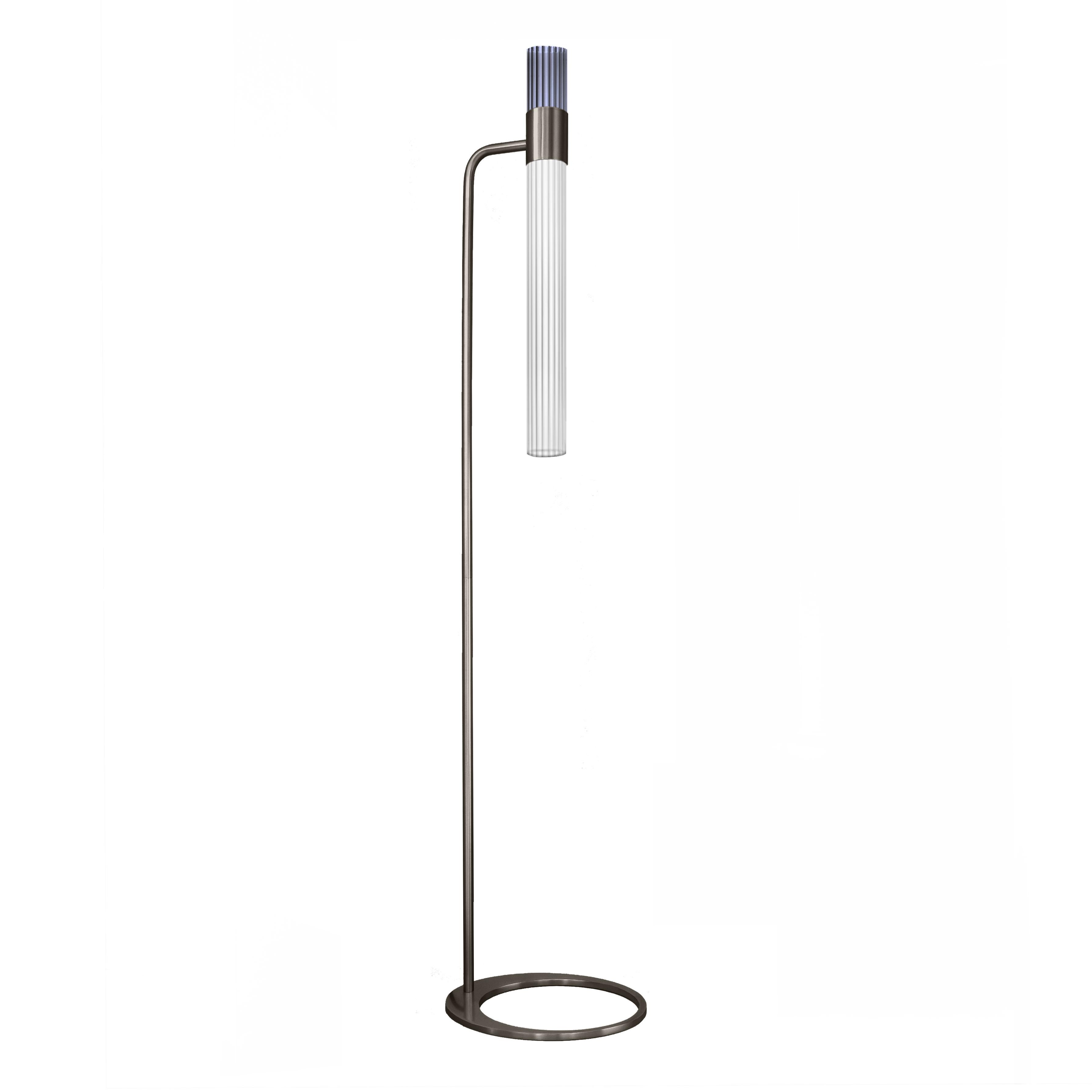 Sbarlusc floor lamp by Luce Tu
Dimensions: 149 x 32.5 cm
Materials: brass and glass

Sbarlusc in Milanese dialect represents the sparkle of a precious and very bright object. The colored glasses, which combine with each other creating games of