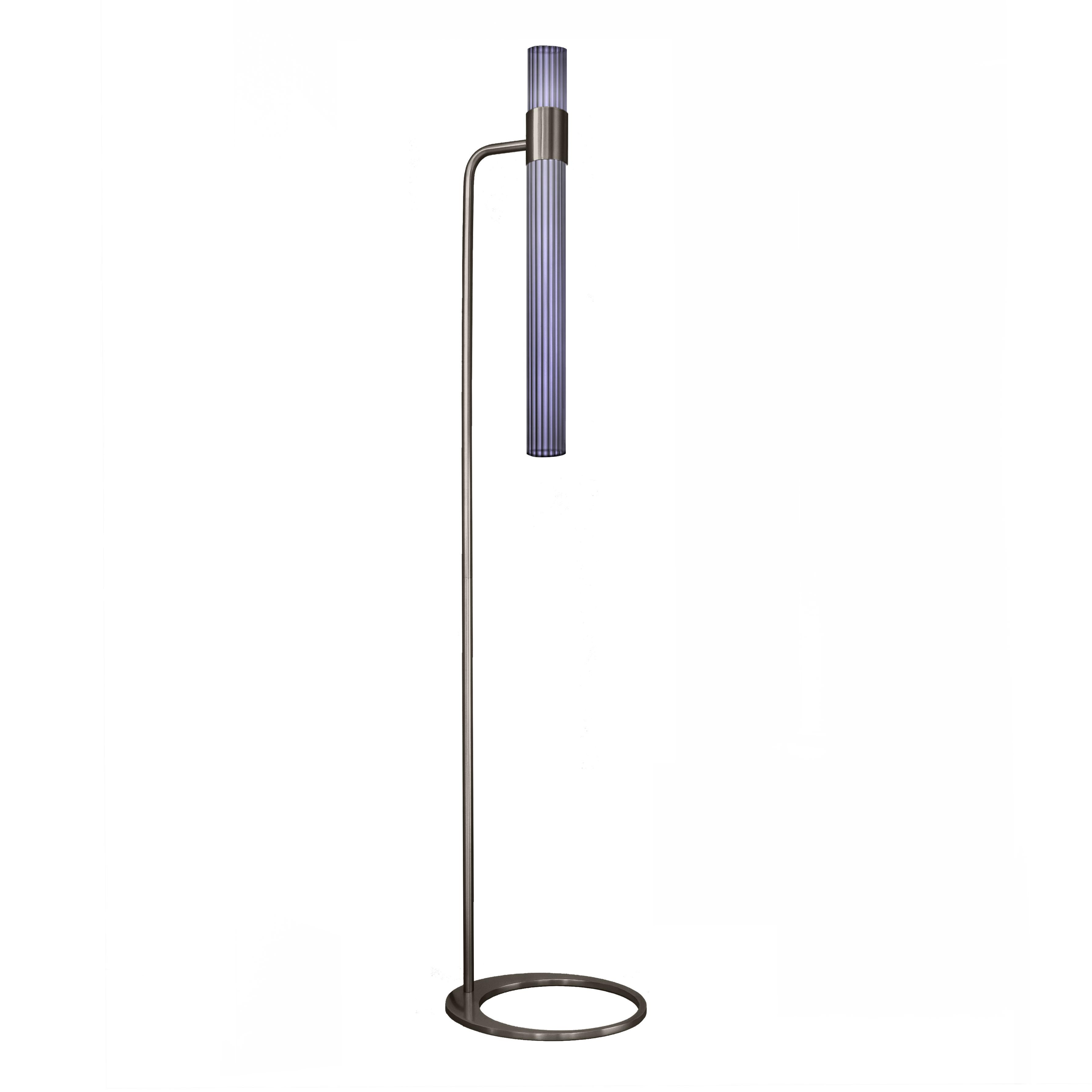 Sbarlusc floor lamp by LUCE TU
Dimensions: 149 x 32.5 cm
Materials: Brass and glass

Sbarlusc in Milanese dialect represents the sparkle of a precious and very bright object. The colored glasses, which combine with each other creating games of