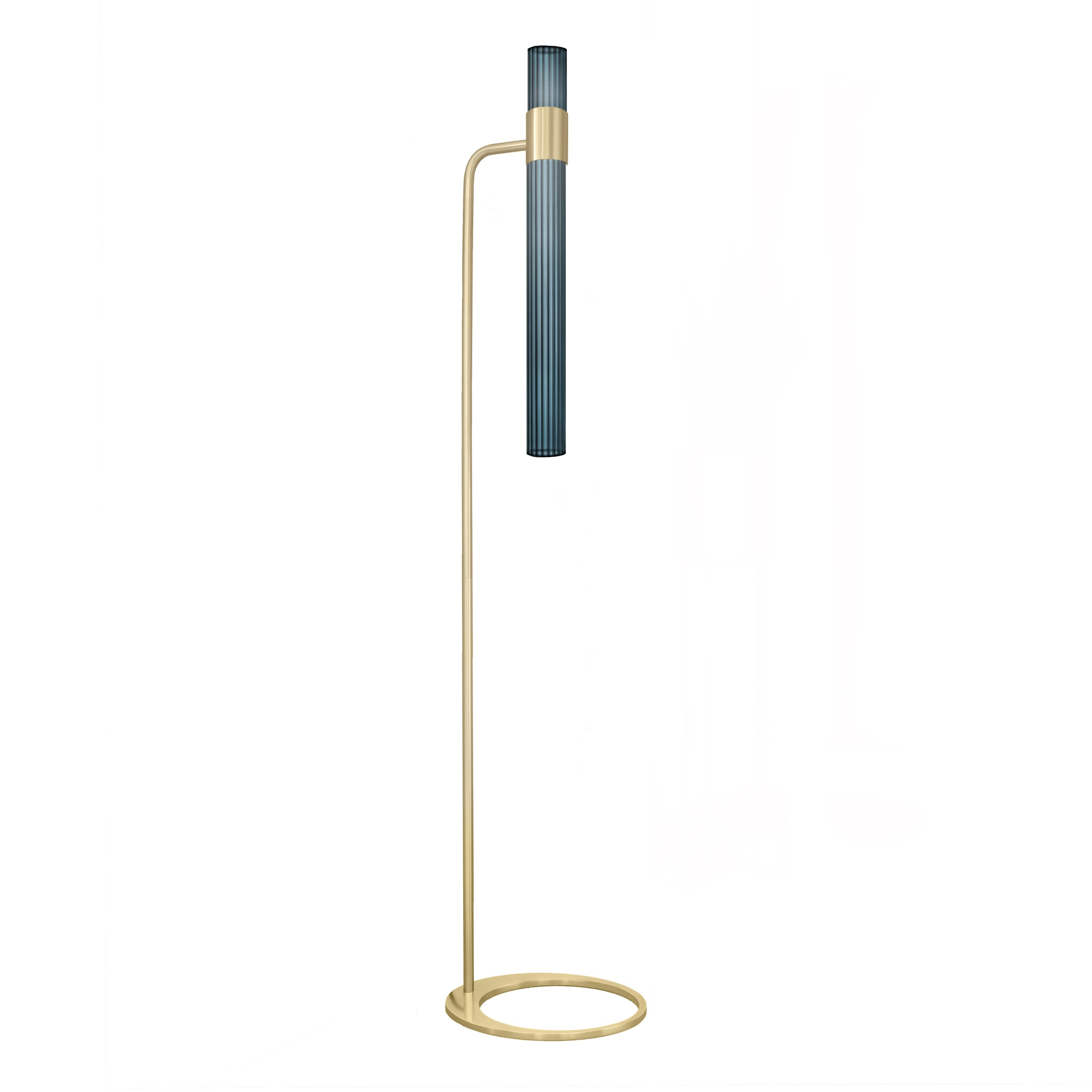 Sbarlusc floor lamp by Luce Tu.
Dimensions: 149 x 32.5 cm.
Materials: brass and glass.

Sbarlusc in Milanese dialect represents the sparkle of a precious and very bright object. The colored glasses, which combine with each other creating games