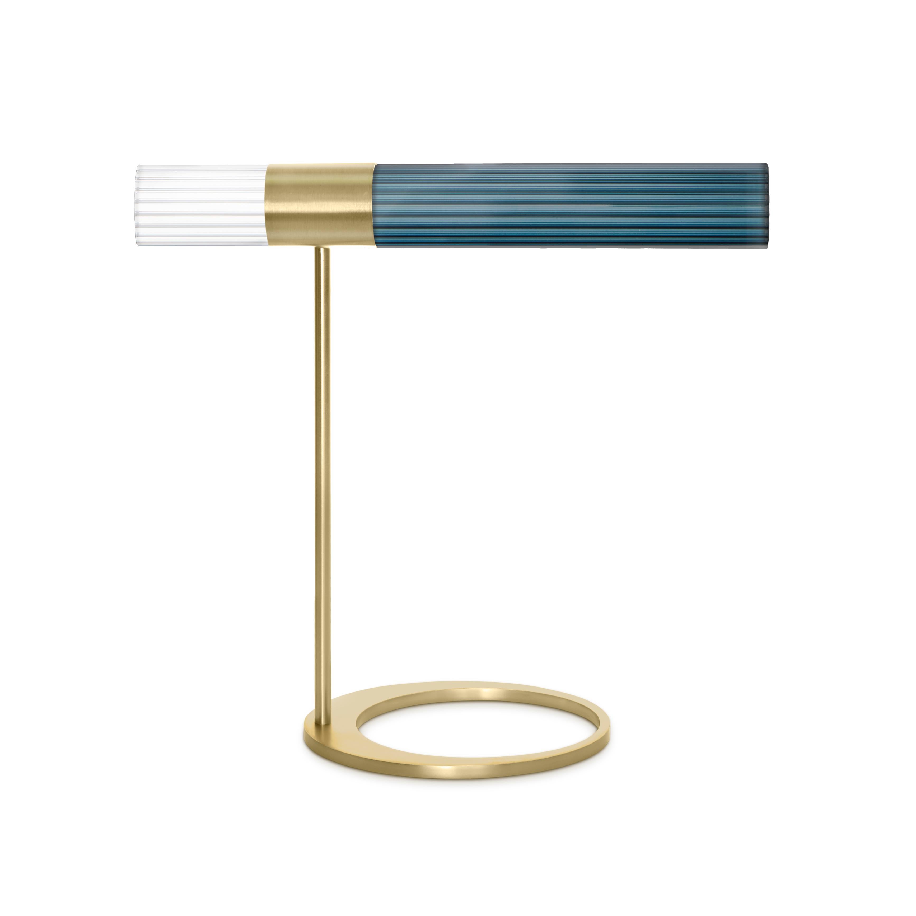 Sbarlusc table lamp by Luce Tu
Dimensions: 49 x 46 cm
Materials: Brass and glass

Sbarlusc in Milanese dialect represents the sparkle of a precious and very bright object. The colored glasses, which combine with each other creating games of
