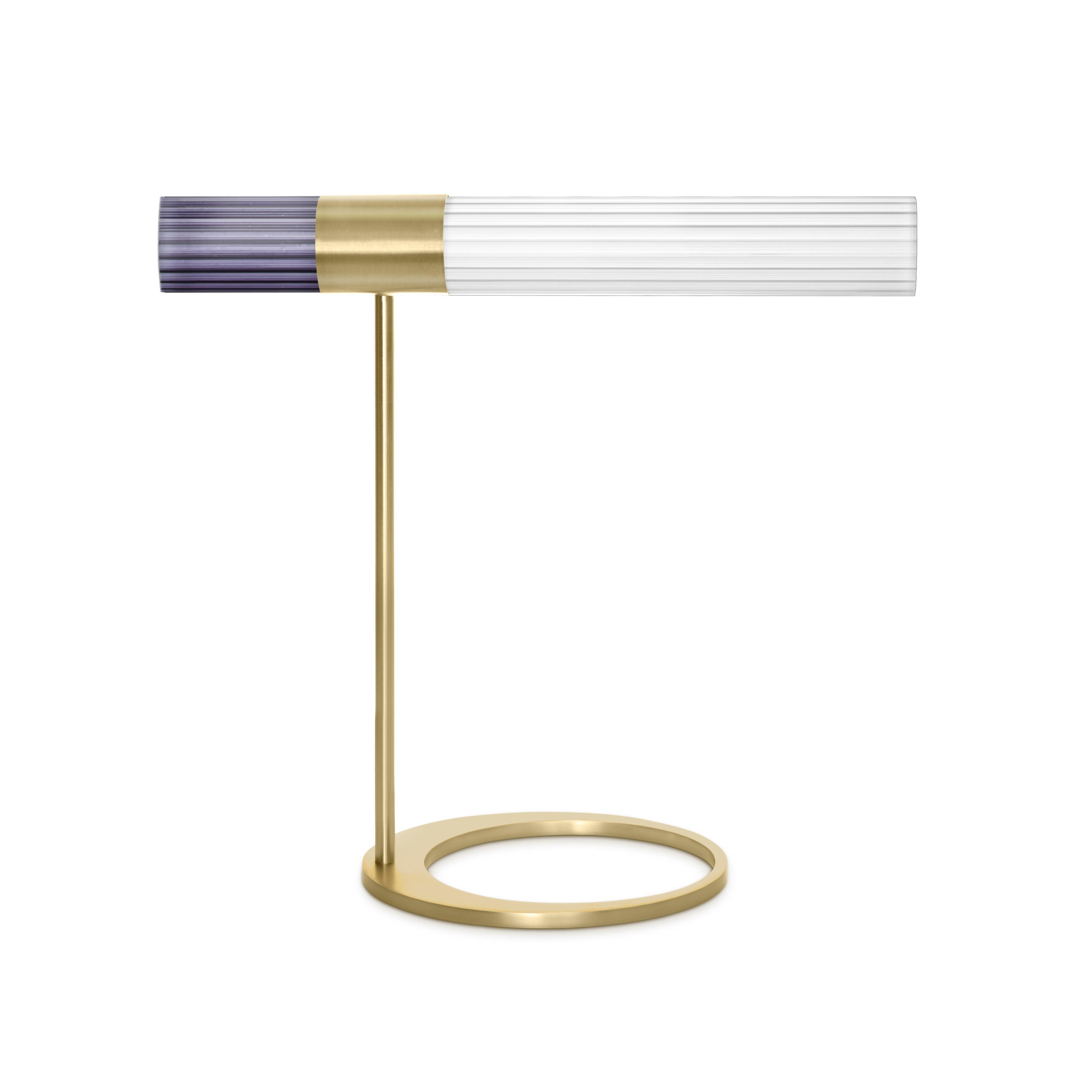 Sbarlusc table lamp by Luce Tu.
Dimensions: 49 x 46 cm
Materials: Brass and glass

Sbarlusc in Milanese dialect represents the sparkle of a precious and very bright object. The colored glasses, which combine with each other creating games of
