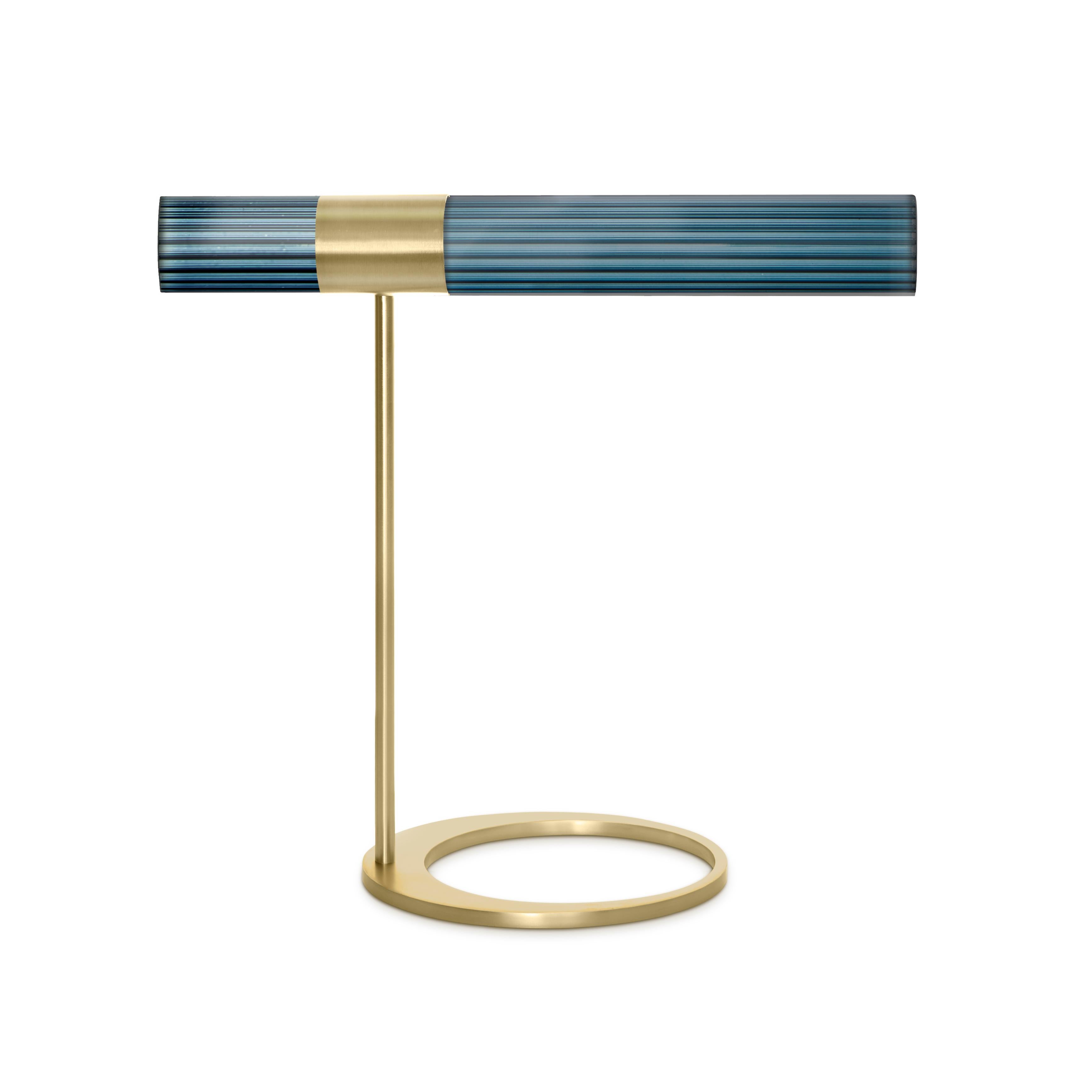 Sbarlusc table lamp by Luce Tu
Dimensions: 49 x 46 cm
Materials: Brass and glass

Sbarlusc in Milanese dialect represents the sparkle of a precious and very bright object. The colored glasses, which combine with each other creating games of