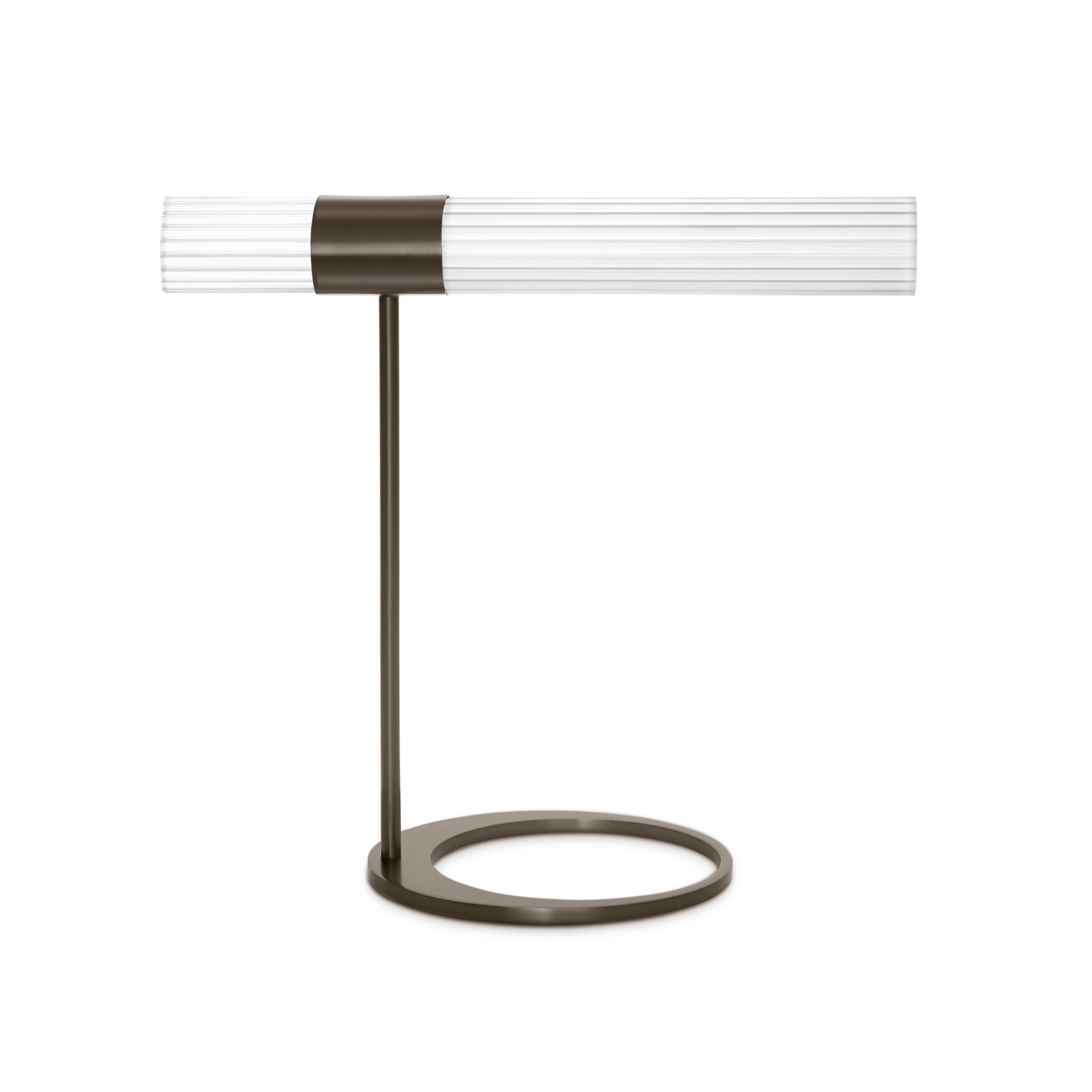 Sbarlusc Table Lamp by Luce Tu
Dimensions: 49 x 46 cm
Materials: Brass and glass

Sbarlusc in the Milanese dialect represents the sparkle of a precious and very bright object. The colored glasses, which combine with each other to create games of