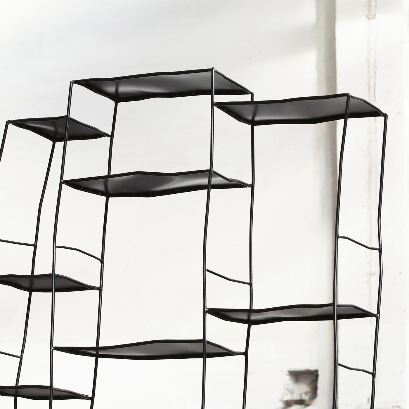 The S_Bookshelf is the perfect addition to a large luminous loft. With its delicate and organic shapes, it divides spaces without sacrificing elegance and style. This unique piece is entirely made of handwrought iron, and the sketch-like design is