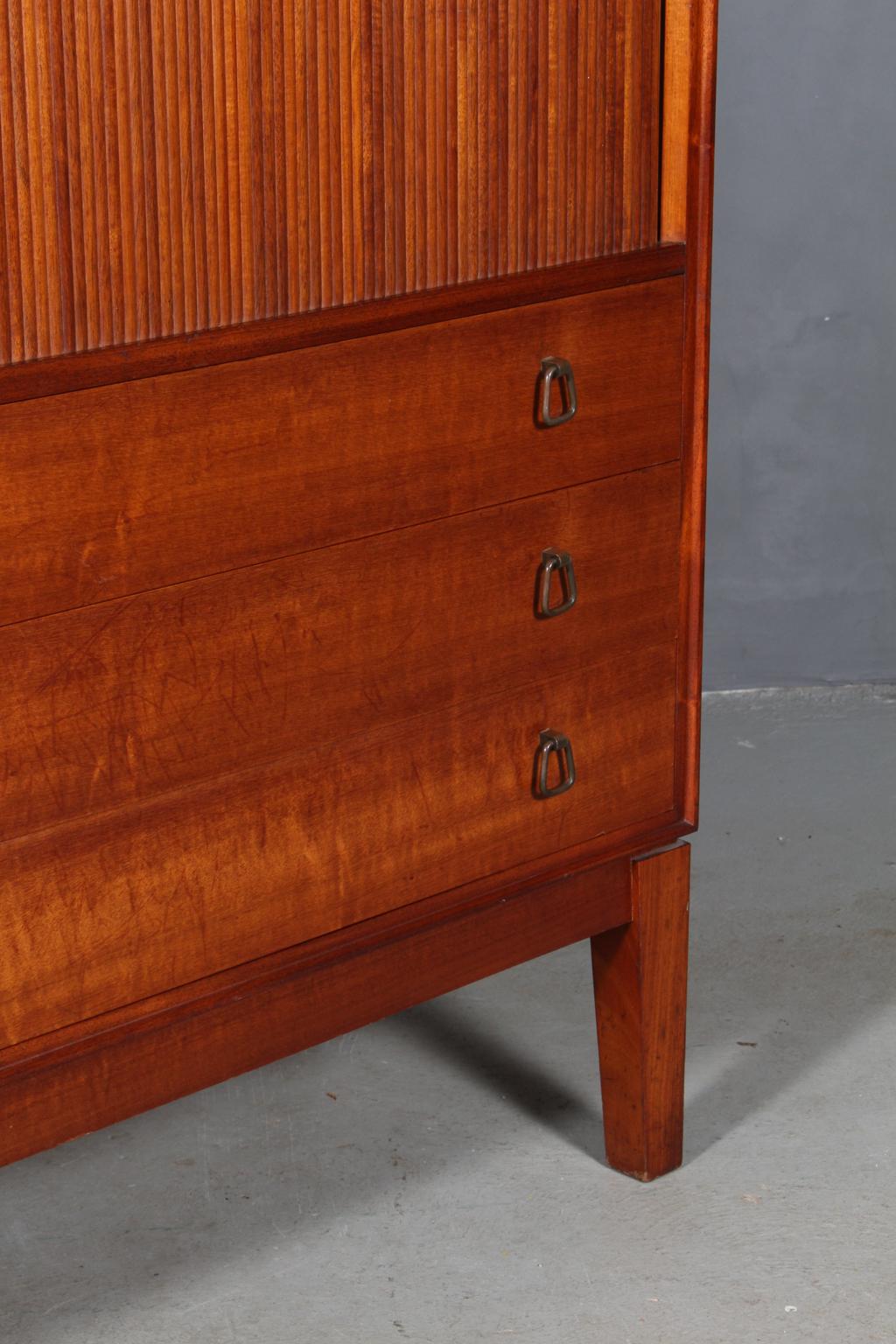 Søborg Møbelfabrik high side board of partly solid Cuba mahogany. 

Six drawers and tambour doors with shelves behind.

Made by Søborg Møbelfabrik in the 1940s.