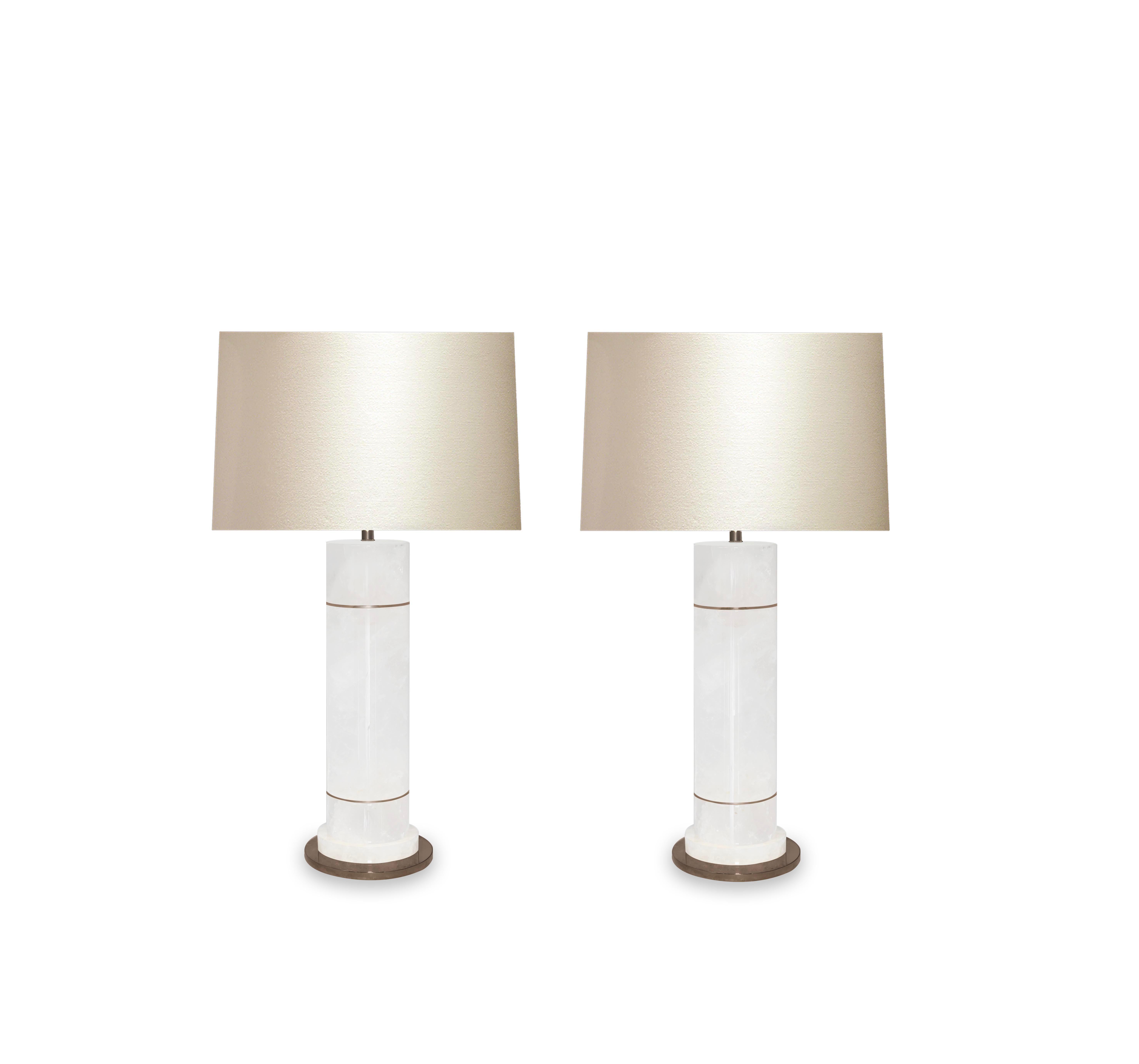 Pair of sectional column rock crystal lamps with antique brass inserts and bases. Created by Phoenix Gallery, NYC.
To the top of rock crystal: 16.75