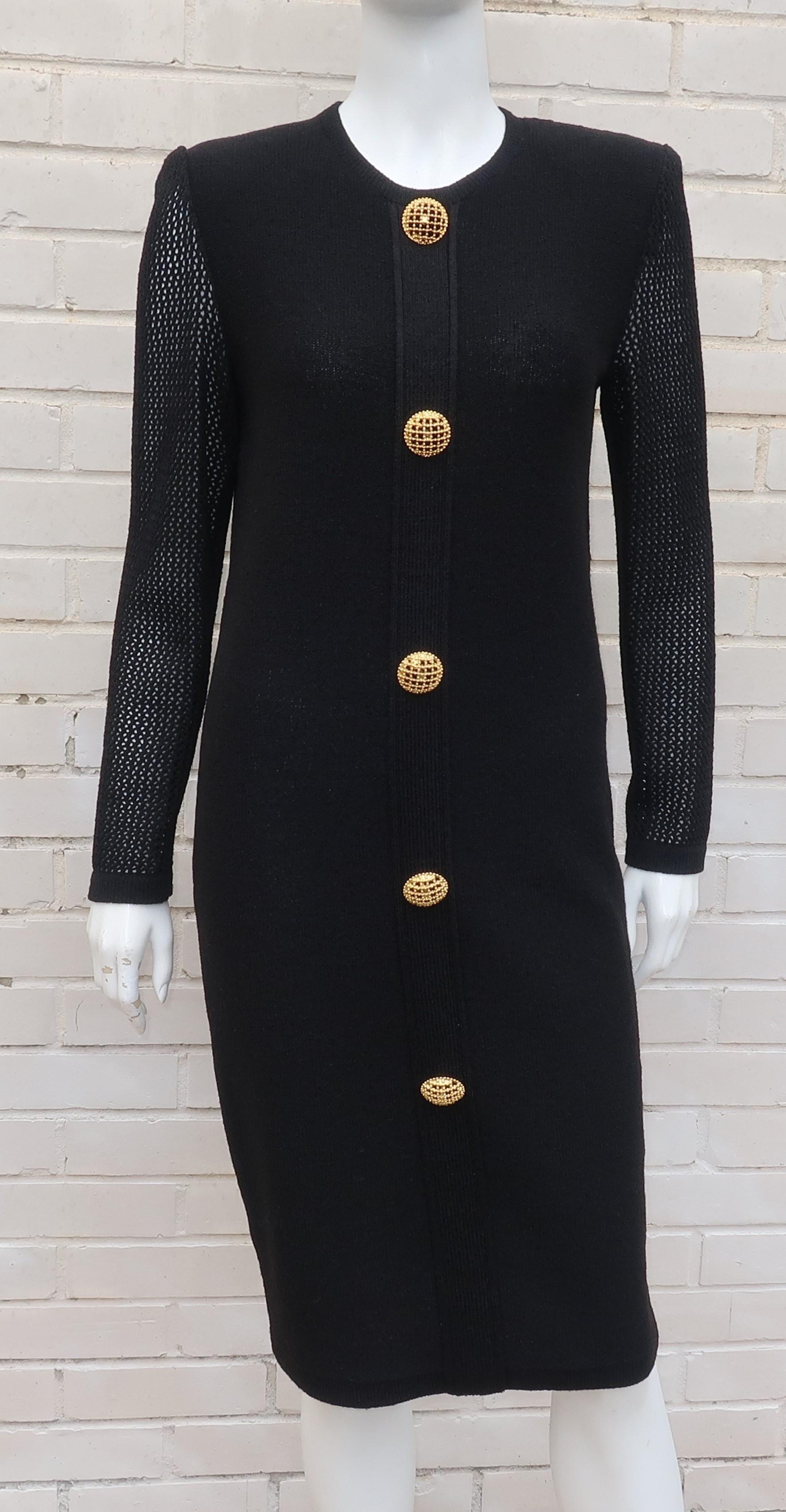 This all occasion Arnold Scaasi black dress is similar in weight and feel to the rayon knitwear favored by the St. John brand.  It zips at the back with a simple sheath silhouette anchored by a shoulder line enhanced with pads and jazzed up by