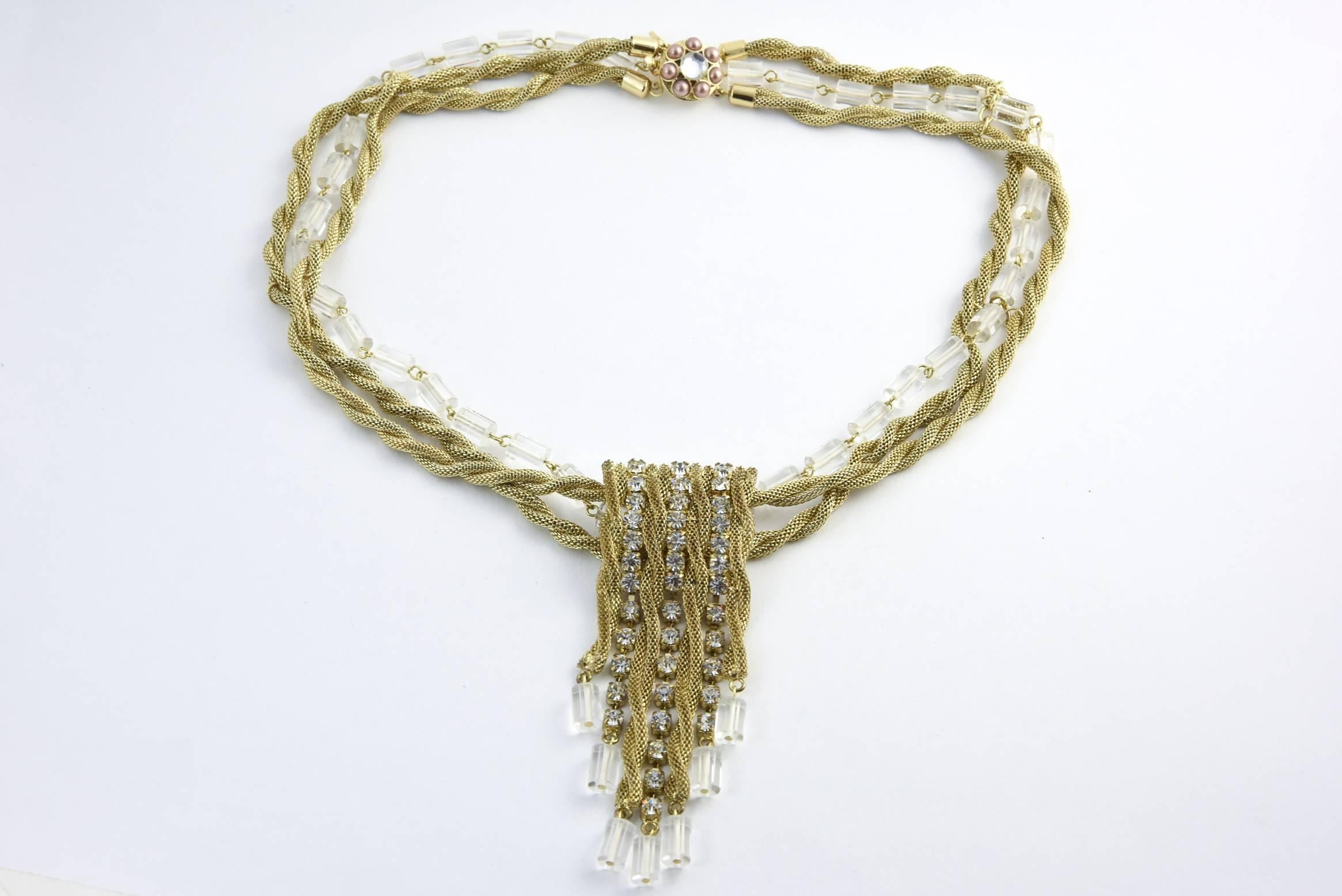 Vintage Scassi goldtone rope necklace surrounding Lucite cylinders and square rhinestones. The clasp has a rhinestone center surrounded by seven faux-pearls. Center rhinestone piece, 4.25