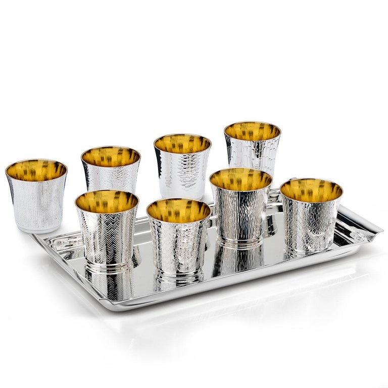 Glorious serving tray with drinking vessels exquisitely crafted in a silver-plated alloy. The interiors of the vessels are plated in gold for a royal feel.