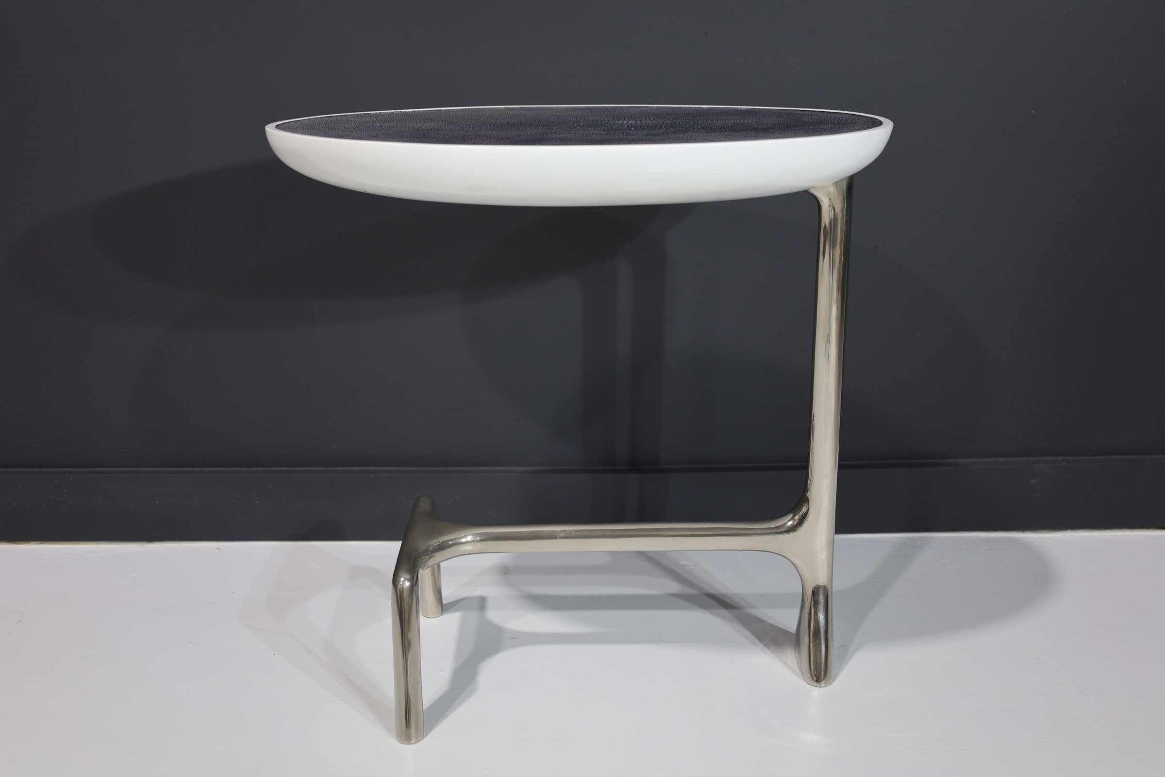 Gorgeous table by Scala Luxury. A polished nickel base and shagreen top. This piece is a solid base side table that has been brush polished. The shagreen top is made from one rare large shagreen skin. The top has a white high gloss lacquer finish
