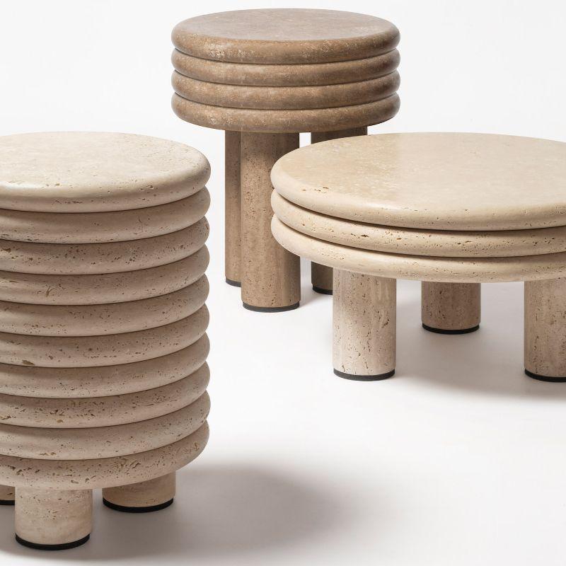 The iconic form of the celebrated Scala stool and coffee tables, winners of the Wallpaper Design Award, is now translated in stone. The ribbed shape is brought back to its roots, the stacked base of a Milanese building, and now the silhouette