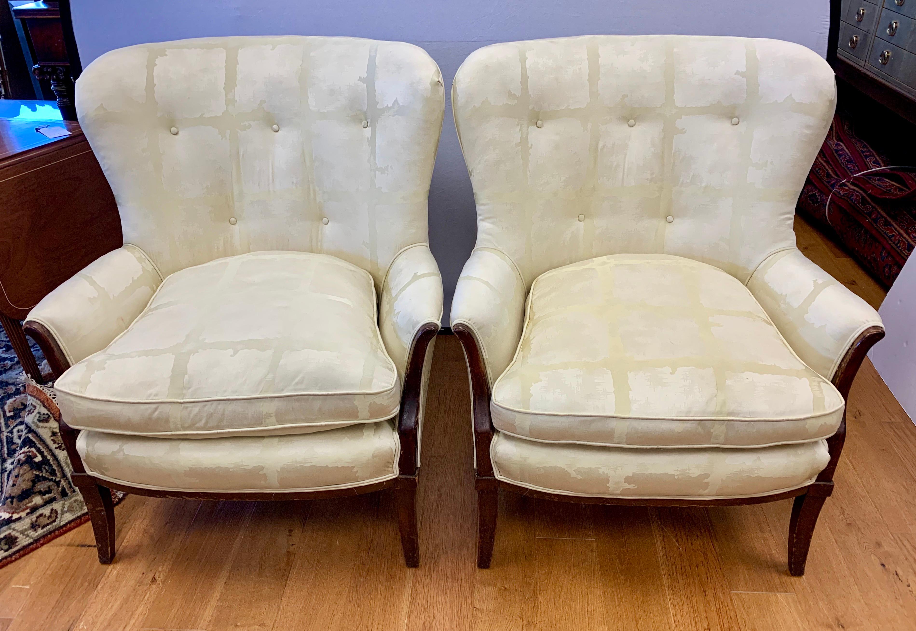 Elegant pair of vintage wingback chairs with Scalamandre fabric which needs a cleaning by the new owner. Fabulous lines and scale, not too big, not too small. Scalamandre fabric is silk.