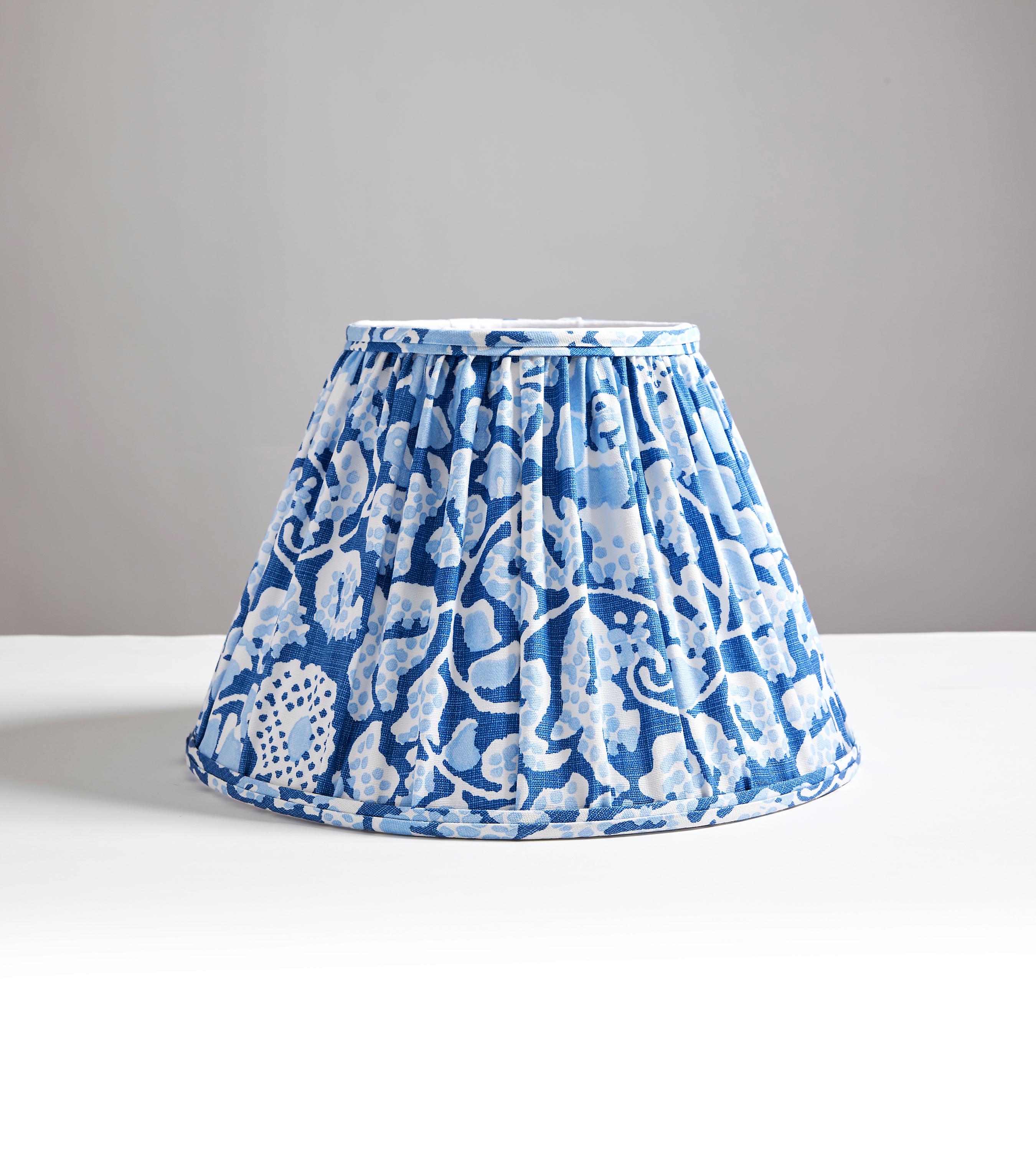 a well-loved pattern from Hinson, is available in printed fabric, wallcovering, luxurious pillows, and now, beautiful, handcrafted lampshades in drum and pleated styles. This energetic, allover pattern features graphic bursts of color.

Hand