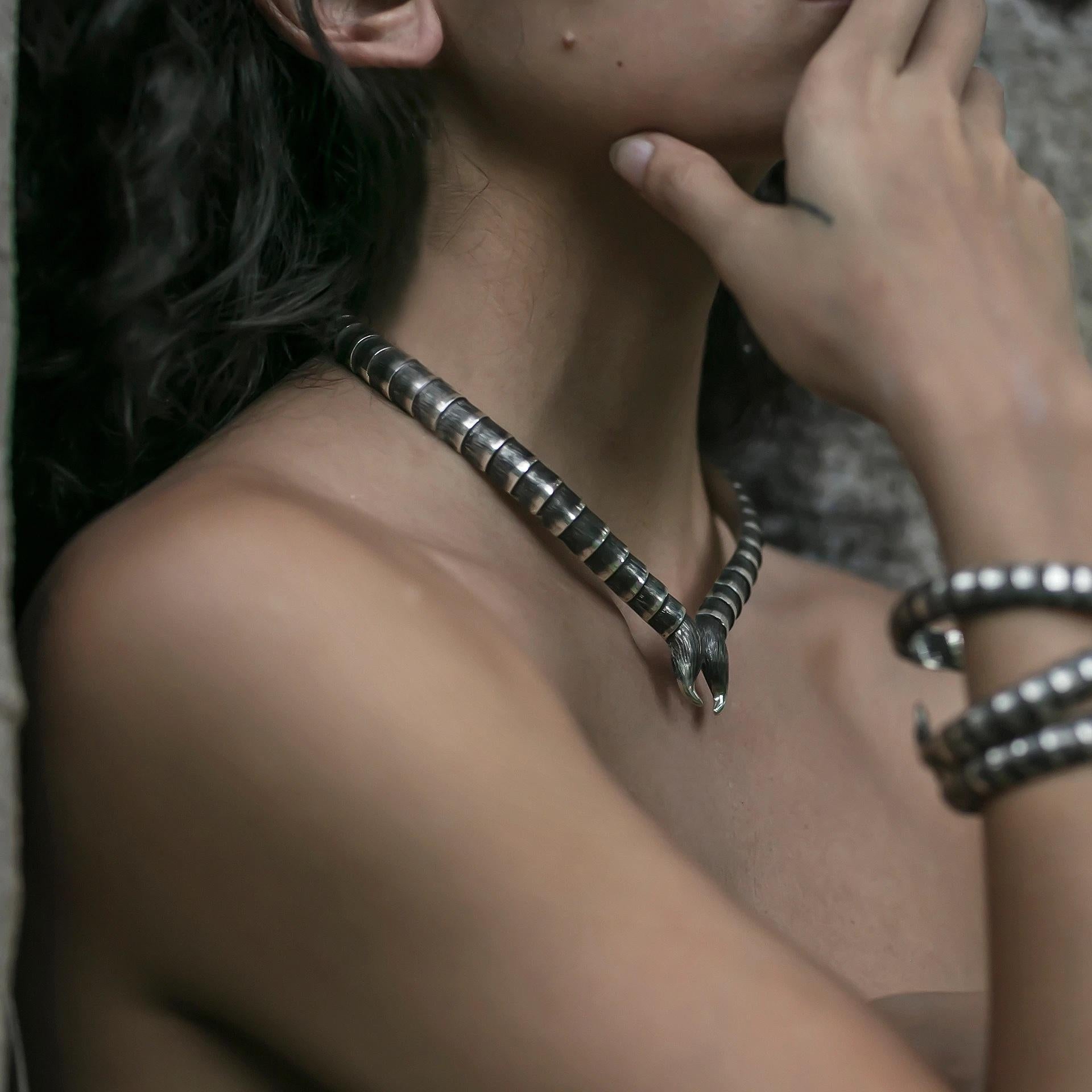 Inspired by scales found in nature this meticulously crafted collar necklace is hand-crafted in Bali by skilled silversmiths. Each scale is individually crafted and layered to form a stunning piece of jewellery. The collar is hinged, curved and