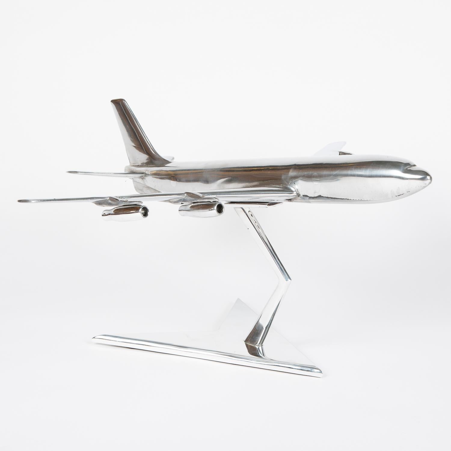 An aluminium scale model of a Boeing 707 – 420, circa 1965.


The Boeing 707 is a long-range, narrow-body airliner, the first jetliner developed and produced by Boeing Commercial Airplanes. The initial 707-120 first flew in December 1957. Pan