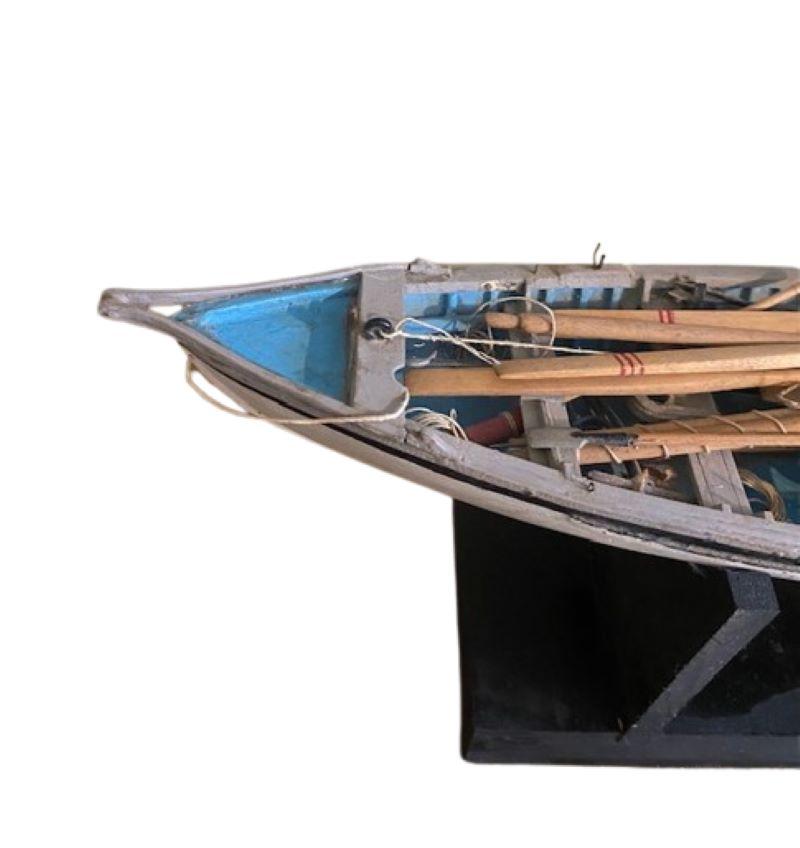 Vintage Scale Model of a Fully Fitted Whale Boat, circa 1950s, a hand crafted wooden model of a carvel hulled whale boat having a smooth strake edge to edge construction, fully fitted with mast and spar, 5 oars, steering sweep, tiller, 2 paddles, 4