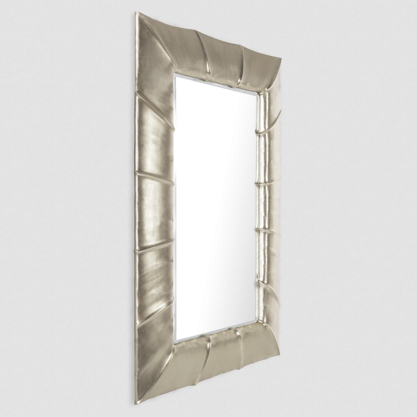 Mirror Scales Silver with hand-carved solid wood frame,
hand-painted with silver leaf. With beveled mirror glass.
Also available in gold leaf, on request.
Available in:
L77 x D4 x H108cm, price: 4900,00€
L94 x D5 x H130cm, price: 6200,00€
L110