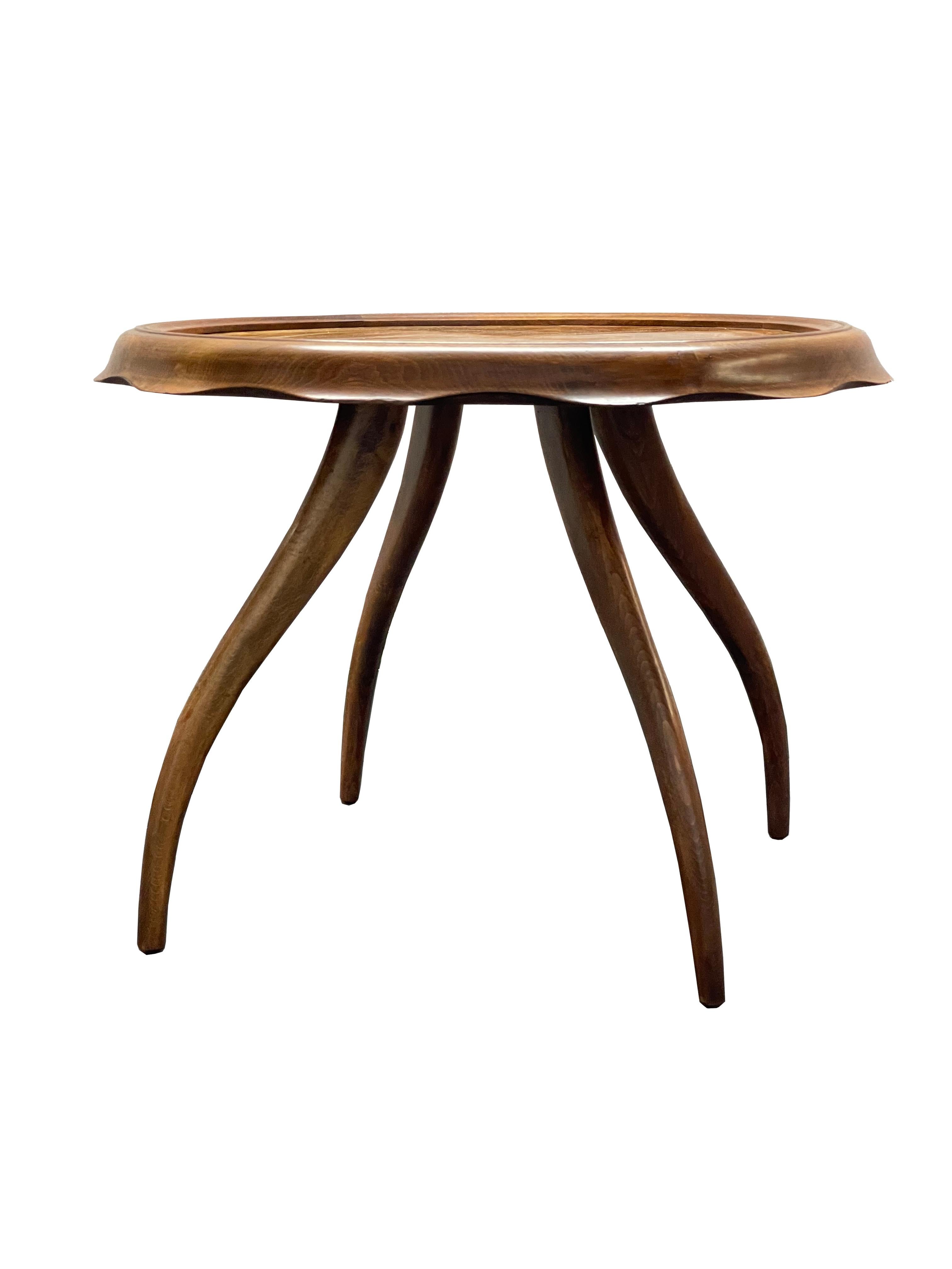 Charming Italian 1940’s hand-made occasional table with a scalloped edge. In blond walnut with an inlayed burl center. Designed by Osvaldo Borsani. 

A reference to the English Pie Crust table. The swooped legs and scalloped top edge combine to