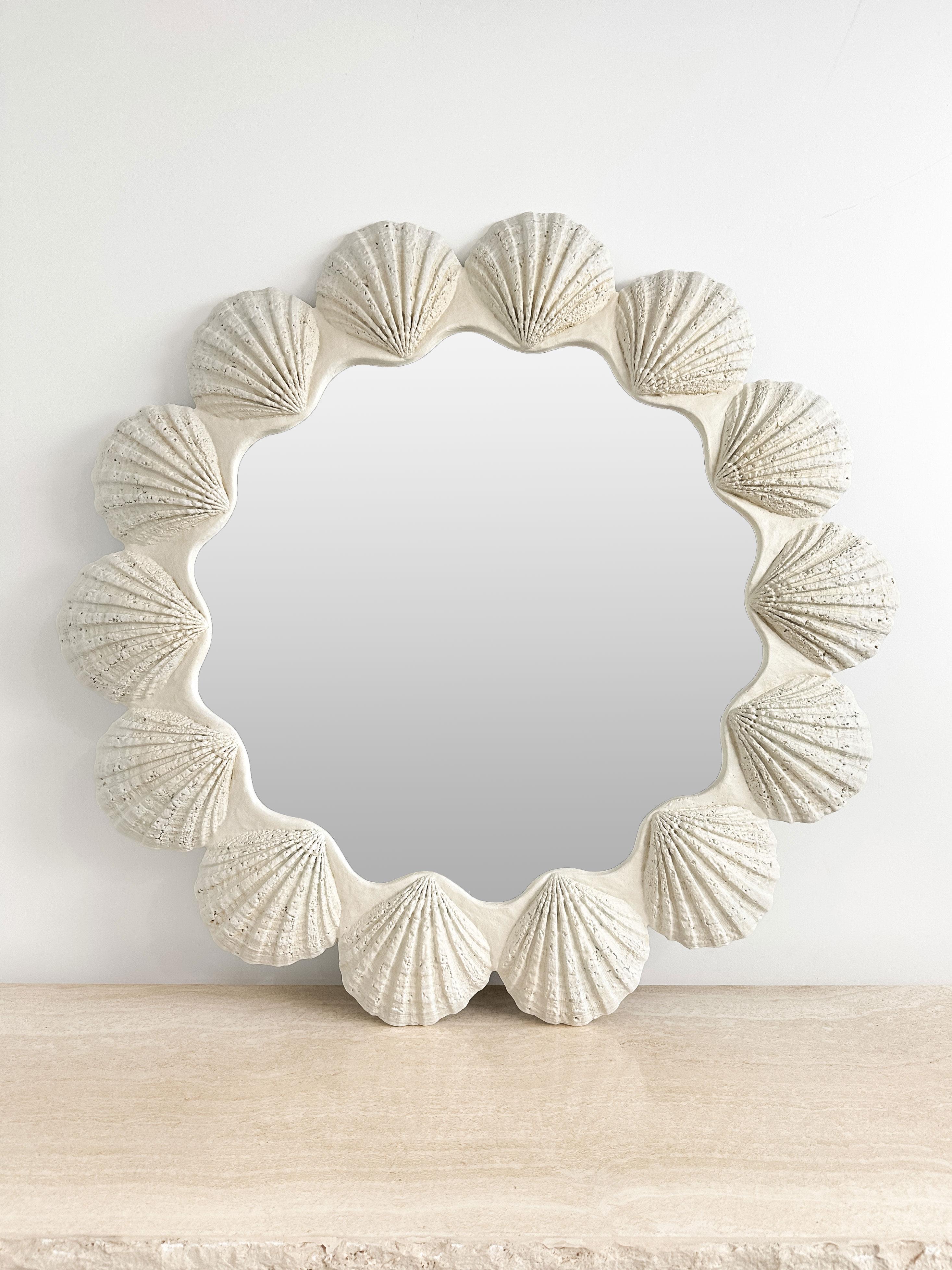 Organic form meets postmodern flair in this oversized 1970s scallop shell mirror — a bold, sculptural piece that balances elegance with a hint of whimsy. The undulating frame, composed of rhythmically repeating shells, creates a sense of movement