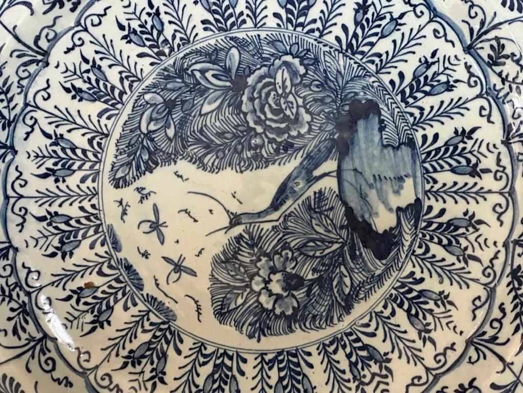 18th Century and Earlier Scalloped Blue and White Delft Charger with Crane & Floral Decoration, 18th Cent For Sale