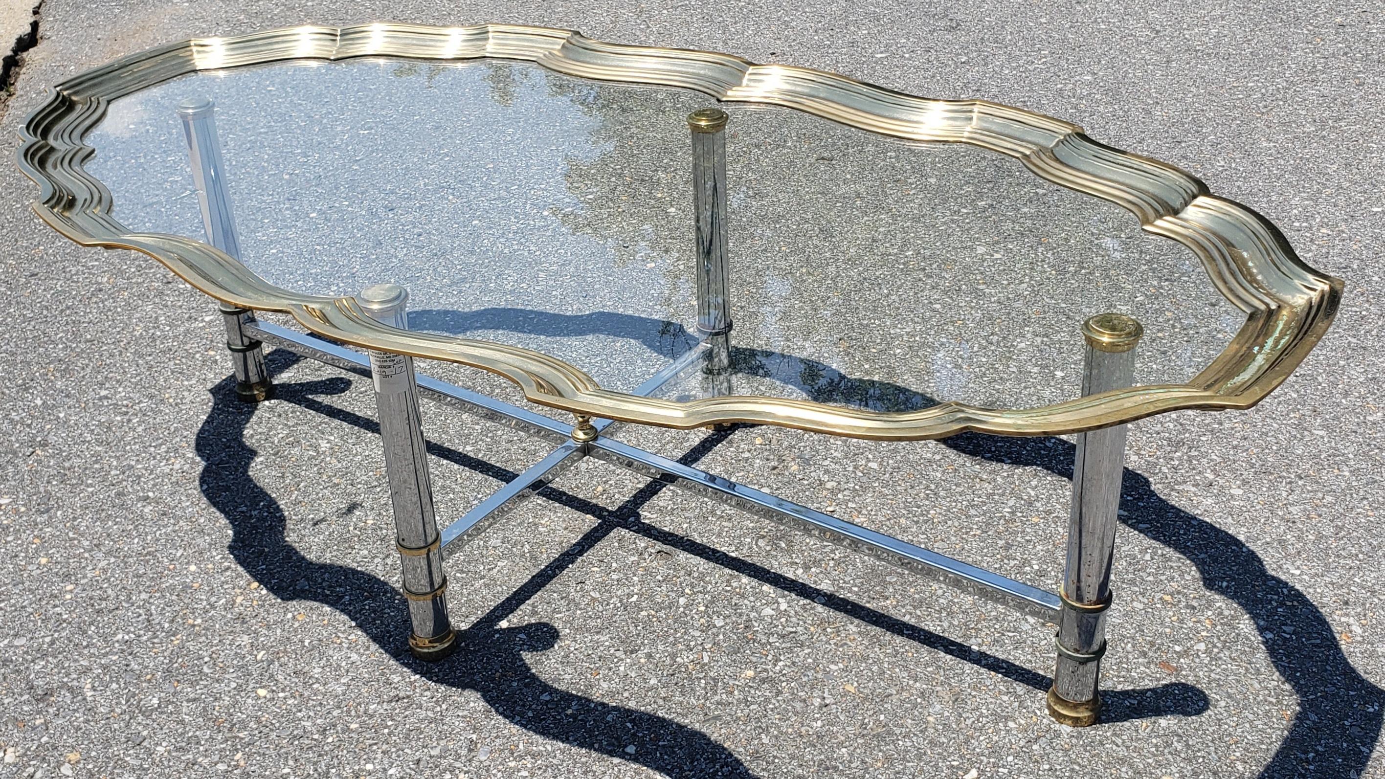 Brushed steel chrome and solid brass scalloped and glass tray top cocktail table. 

Good vintage condition. Minor tarnish on brass and minor chrome loss on steel frame

W3LR053122.
 