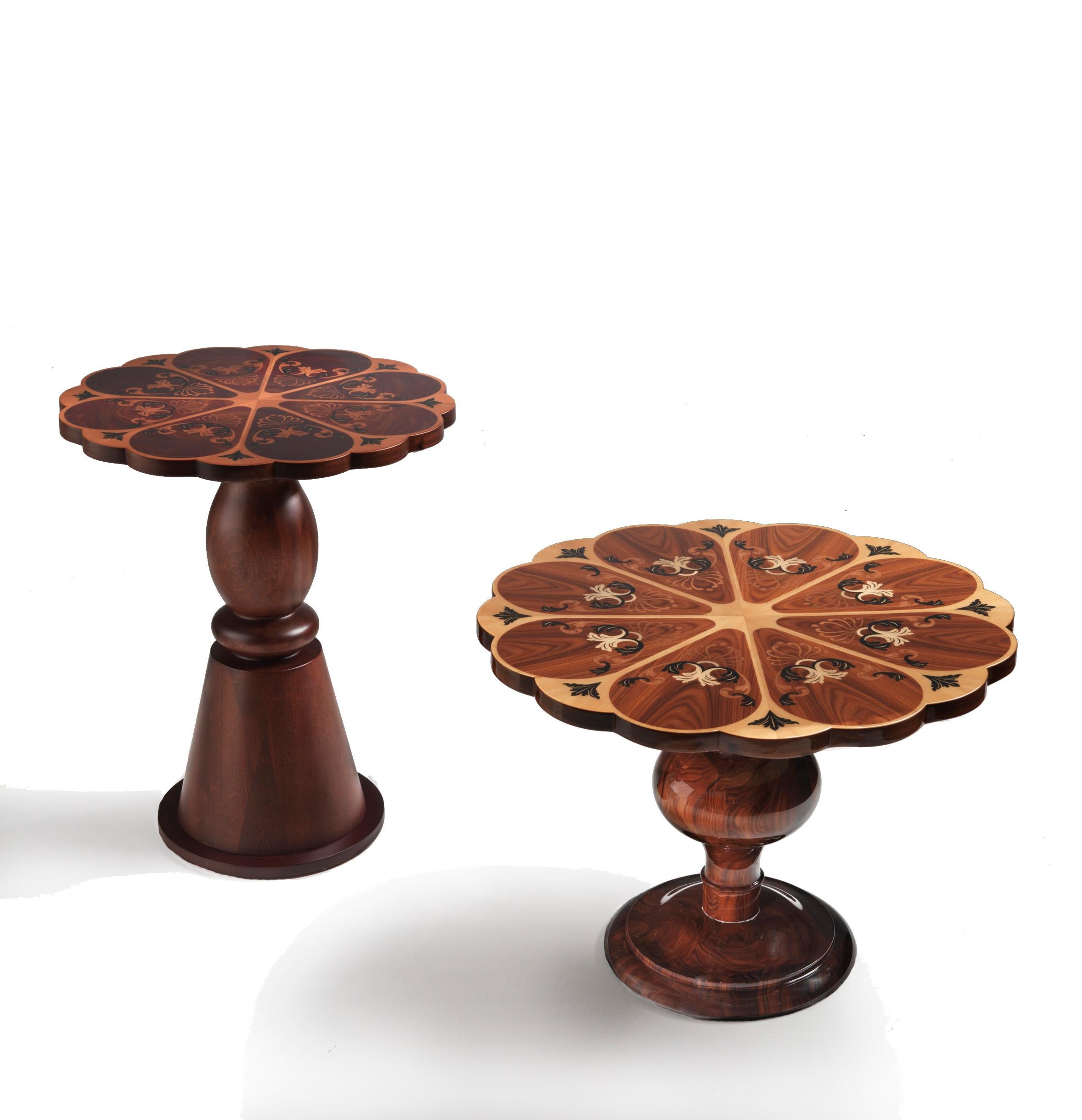 Scalloped Lamp Table is an exquisite blend of artistry and functionality that adds a touch of elegance to any space. The central turned column and the delicately shaped frame top create a visual symphony that draws the eye to the intricate inlay,