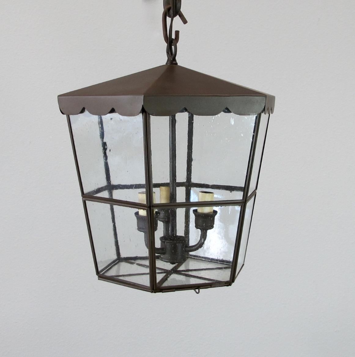 Part of the chandelier product line, the scalloped coast Lantern is perfect for interior or exterior use. Seeded glass with closed bottom for easy access to replace bulbs. 3 candelabra base bulbs up to 60 watts or socket. Chain and canopy included,