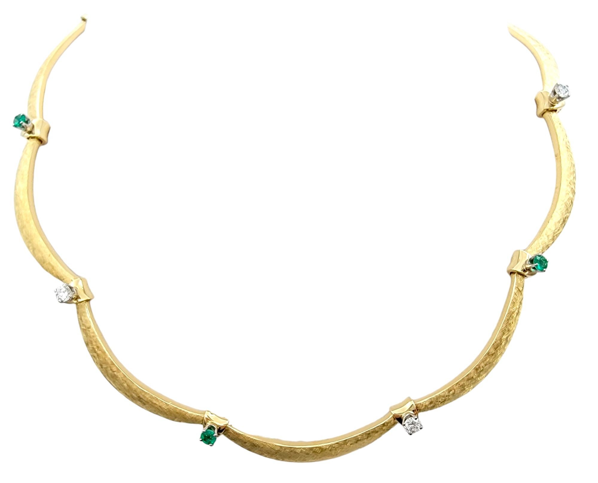 This exquisite emerald and diamond scalloped choker necklace is masterfully crafted in 18 karat yellow gold. This luxurious piece features a stunning design with alternating vibrant emeralds and dazzling diamonds. The choker’s unique scalloped