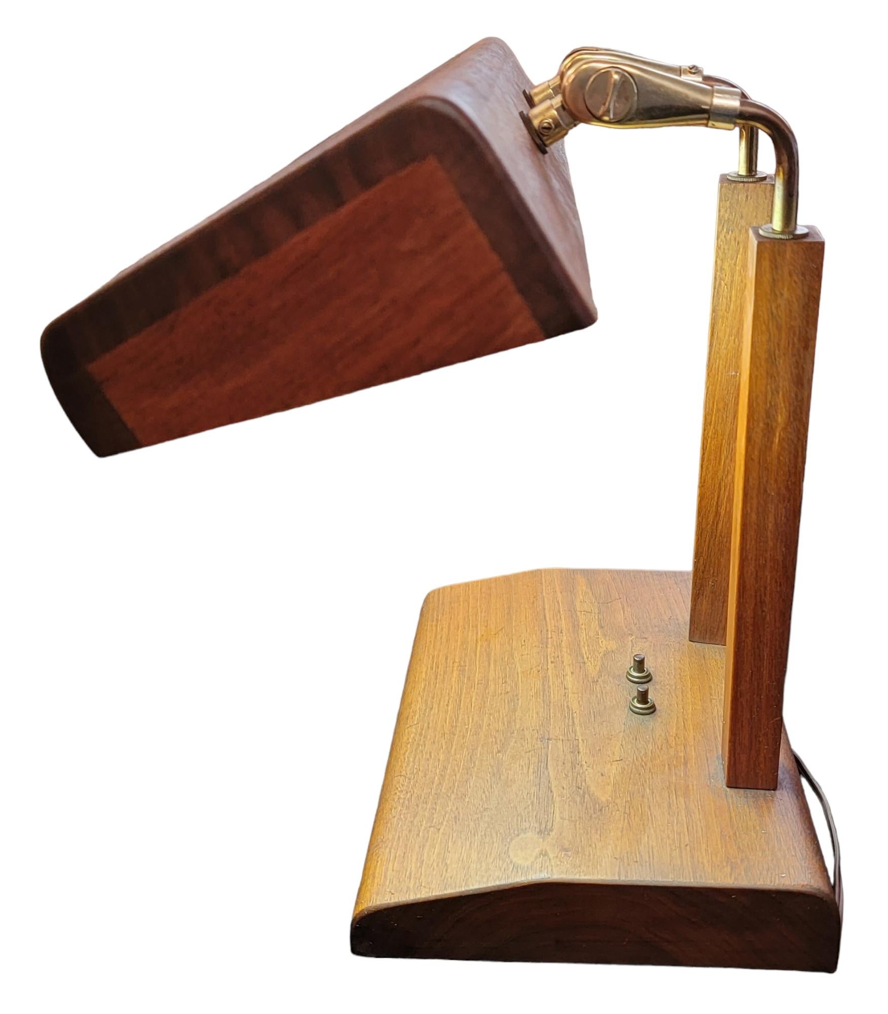 Hand Made wood and brass Scandinavian table lamp. Designed for ease of use and to provide plenty of light to its surrounding area. The neck of the light is bronze and adjustable up and down goose neck design.
