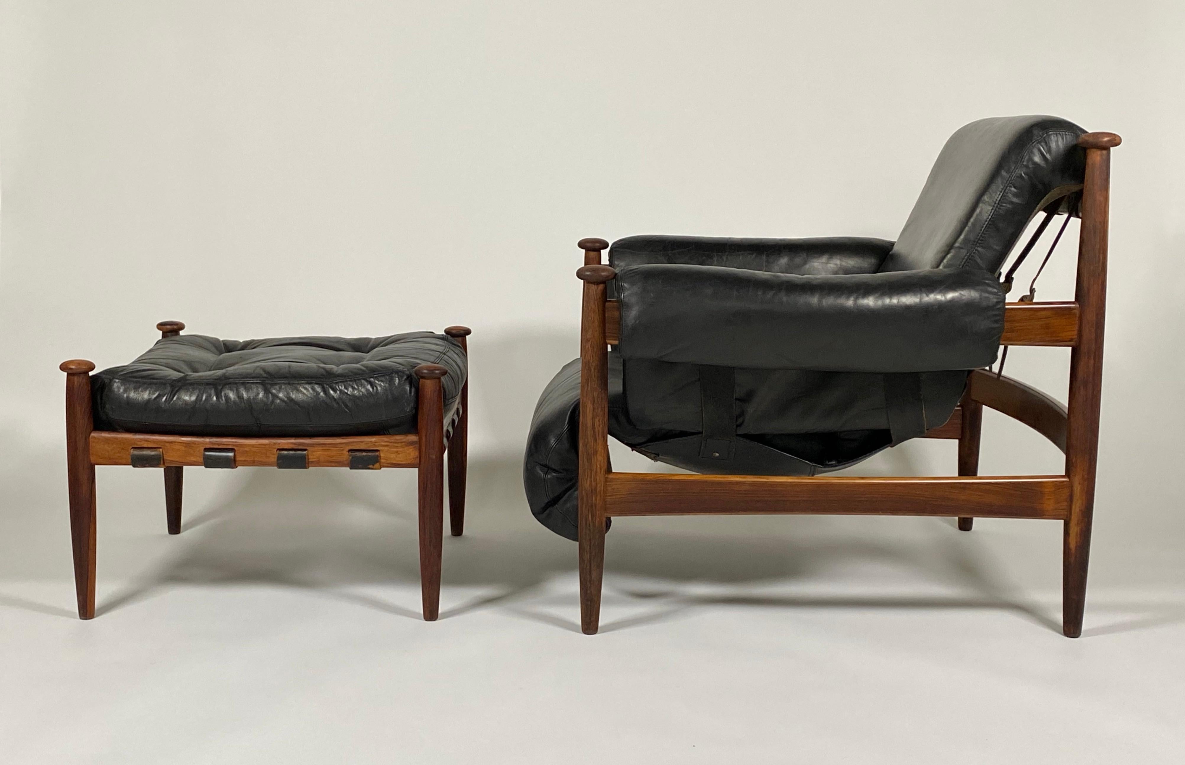 Circa 1960s Amiral Lounge and Ottoman by Swedish designer Eric Merthen for IRE Industri Ire AB Skillingaryd, Sweden. Constructed of rosewood and fine leather, this design has more Organic Modern approach then many pieces out of this region during