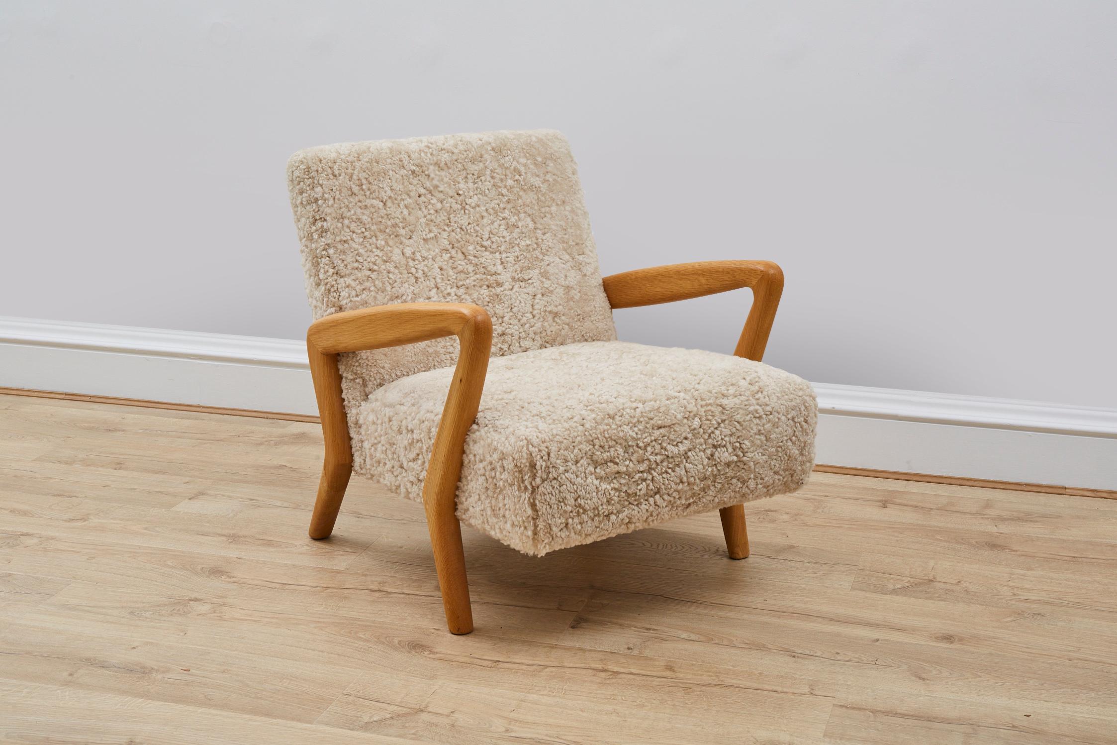 A stylish armchair handmade in the UK by our team of skilled craftsmen.

The chair is made from a solid English oak frame with sculptural arms. 

The upholstery is made from ethically sourced sheepskin from Scandinavia. 

*Please note this