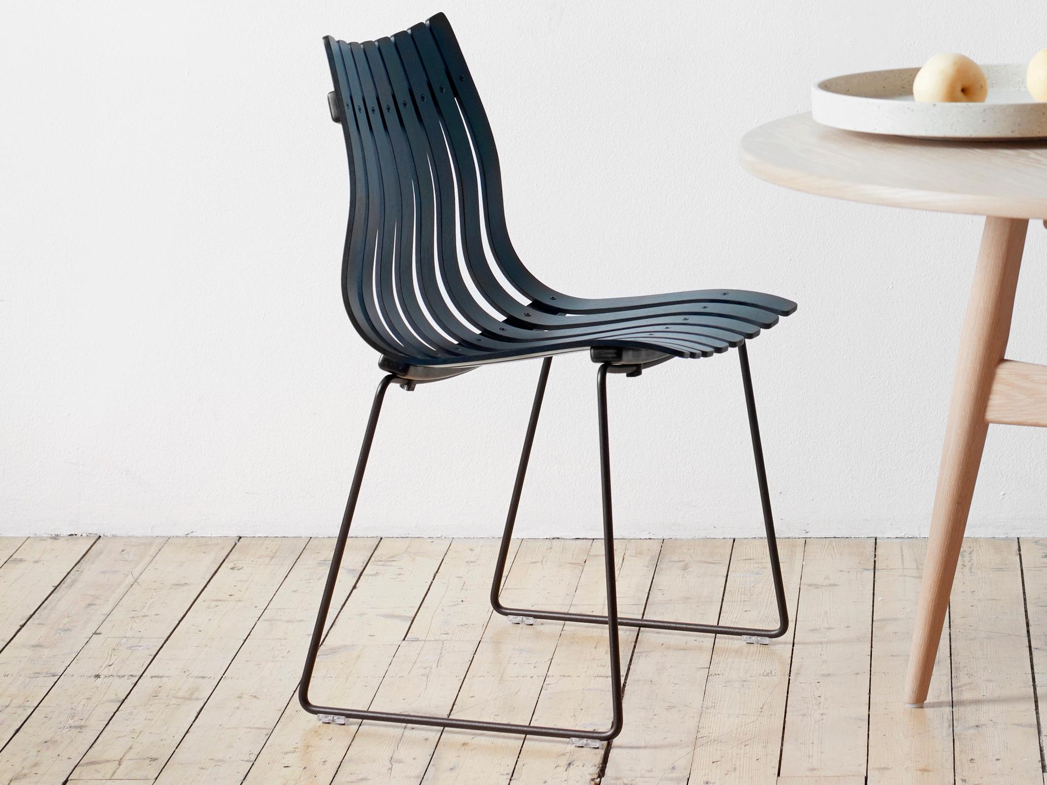 Scandia Junior chair. New edition. Created in 1957 by designer Hans Brattrud, Scandia junior is an iconic chair of Scandinavian design with its shell in glued laminated arched and veneered. The Scandia junior chair is stackable available in 3 wood