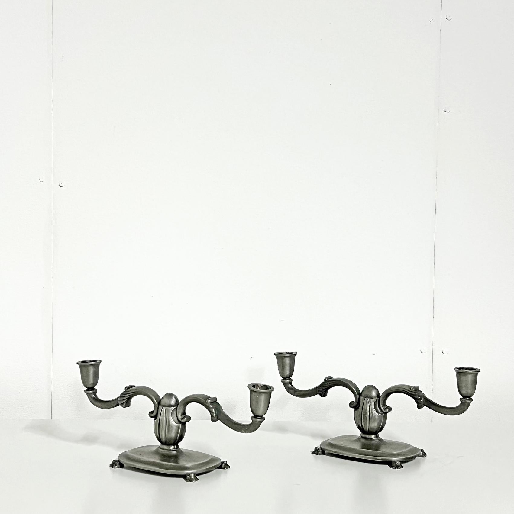 Scandianavian Modern cast pewter candle holders, set of two, by GAB 1938.
Signed with makers mark. 
Good vintage condition, wear and patina consistent with age and use. 