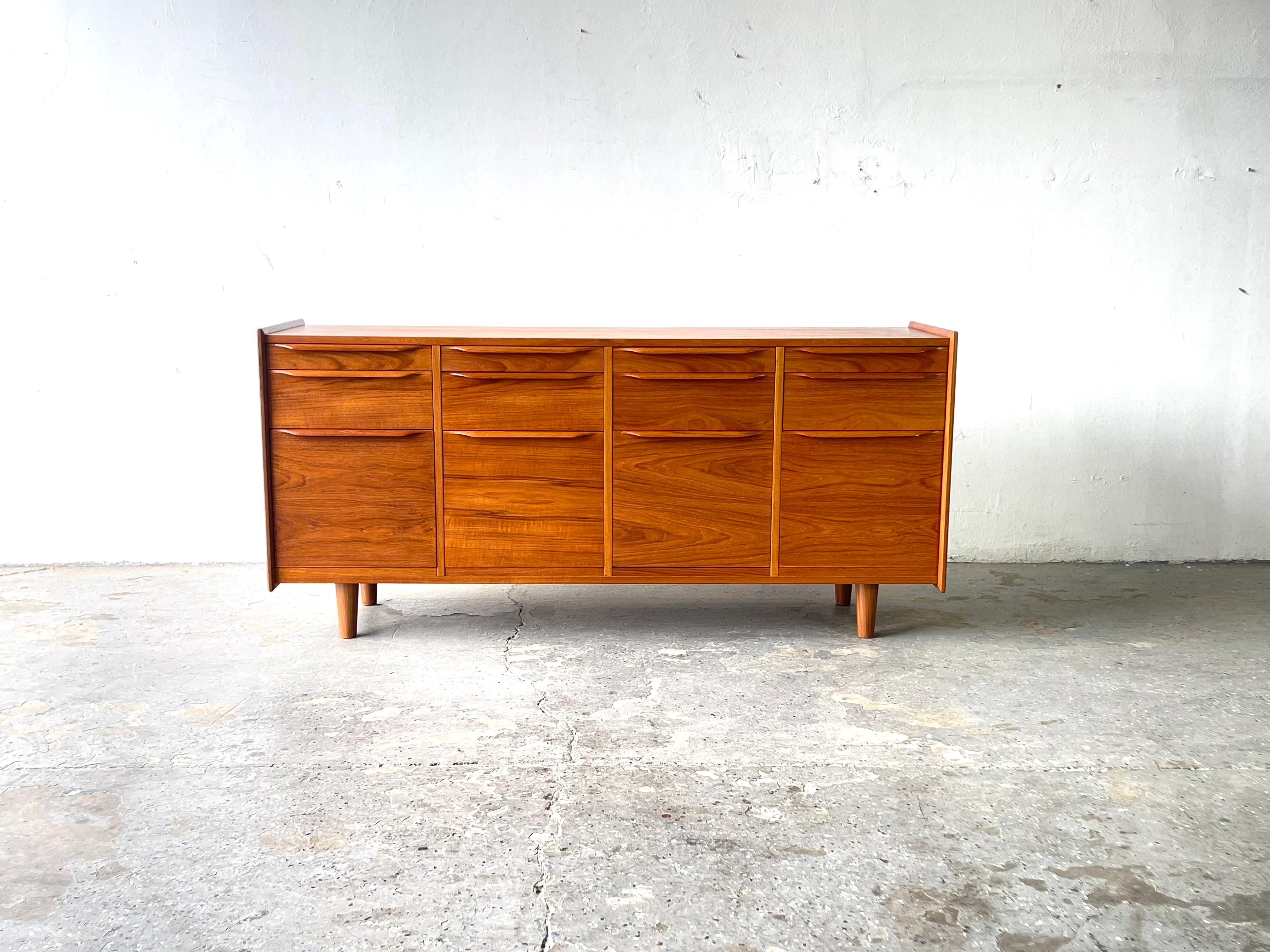 
Handsome 1960’s to 70’s Danish Modern Teak twelve drawer Office credenza. Lots of space for files and other storage unique design Probably never see another one like it . 


64.5 in wide 18 in deep 30.25 in high
Imported by Scandiline of