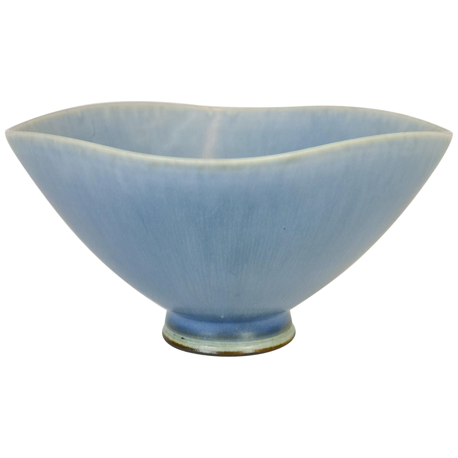 This bowl has everything working for it. Wonderful sculptured and with a stunning glaze that shifts in color. 
It was made by Berndt Friberg at Gustavsberg Studio 1971 and is marked in the bottom. 

Very good condition. 

Measures: H 7 cm, D 15