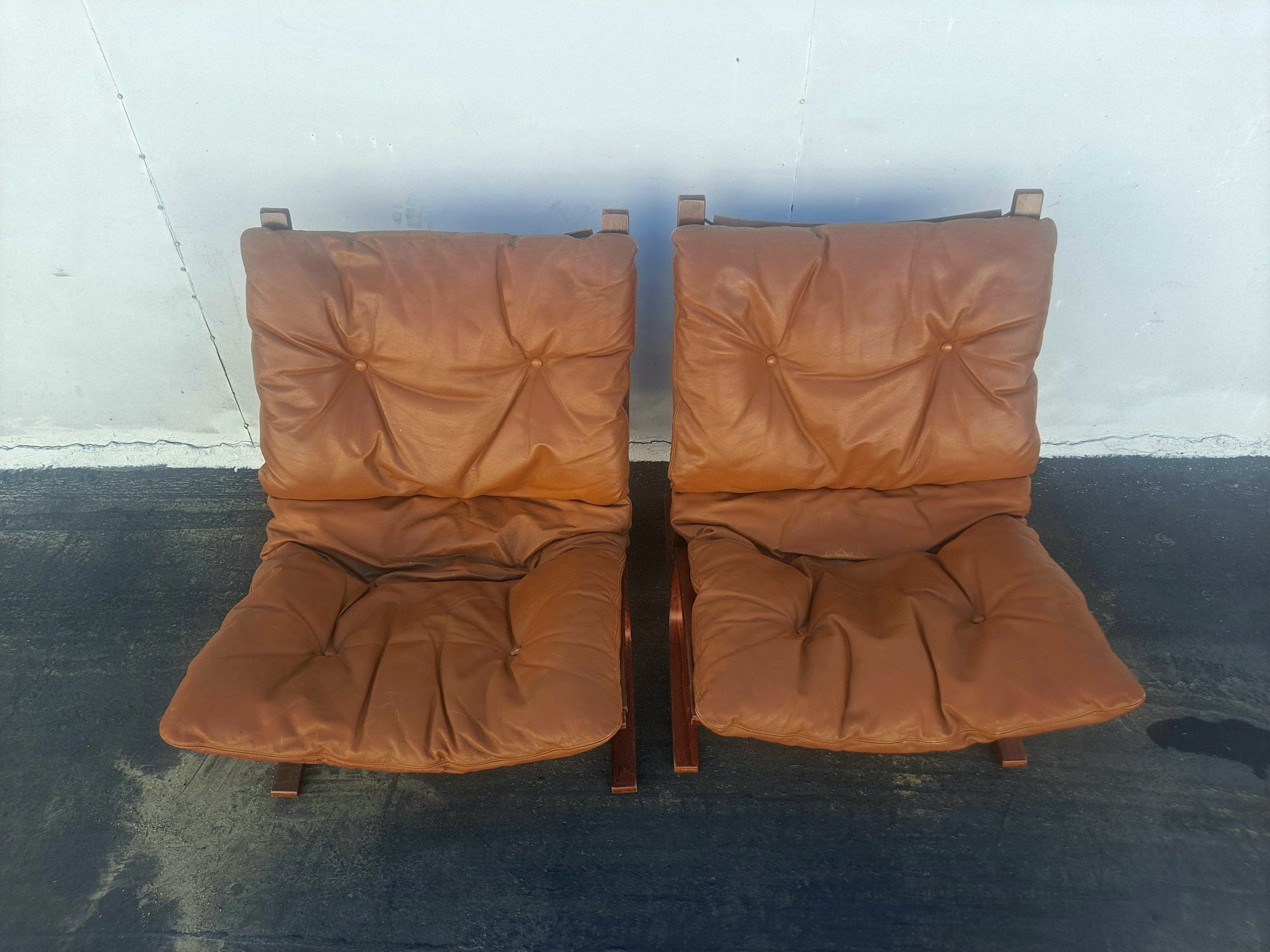 Scandinavian pair of leather chairs by Westinofa Furniture Norway Rosewood frame and leather upholstery very comfortable.