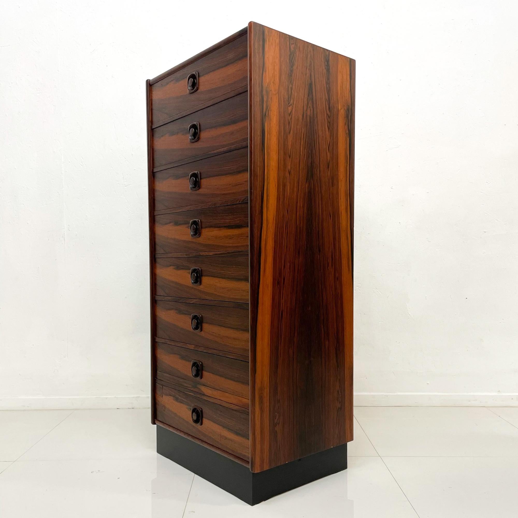 For your consideration, a tall chest of drawers dresser, cabinet. Made in Sweden circa the 1970s. From the period of Scandinavia Modern, Danish Mid-Century Modern.

Constructed with brazilian rosewood. A total of eight (8) drawers. All the drawers