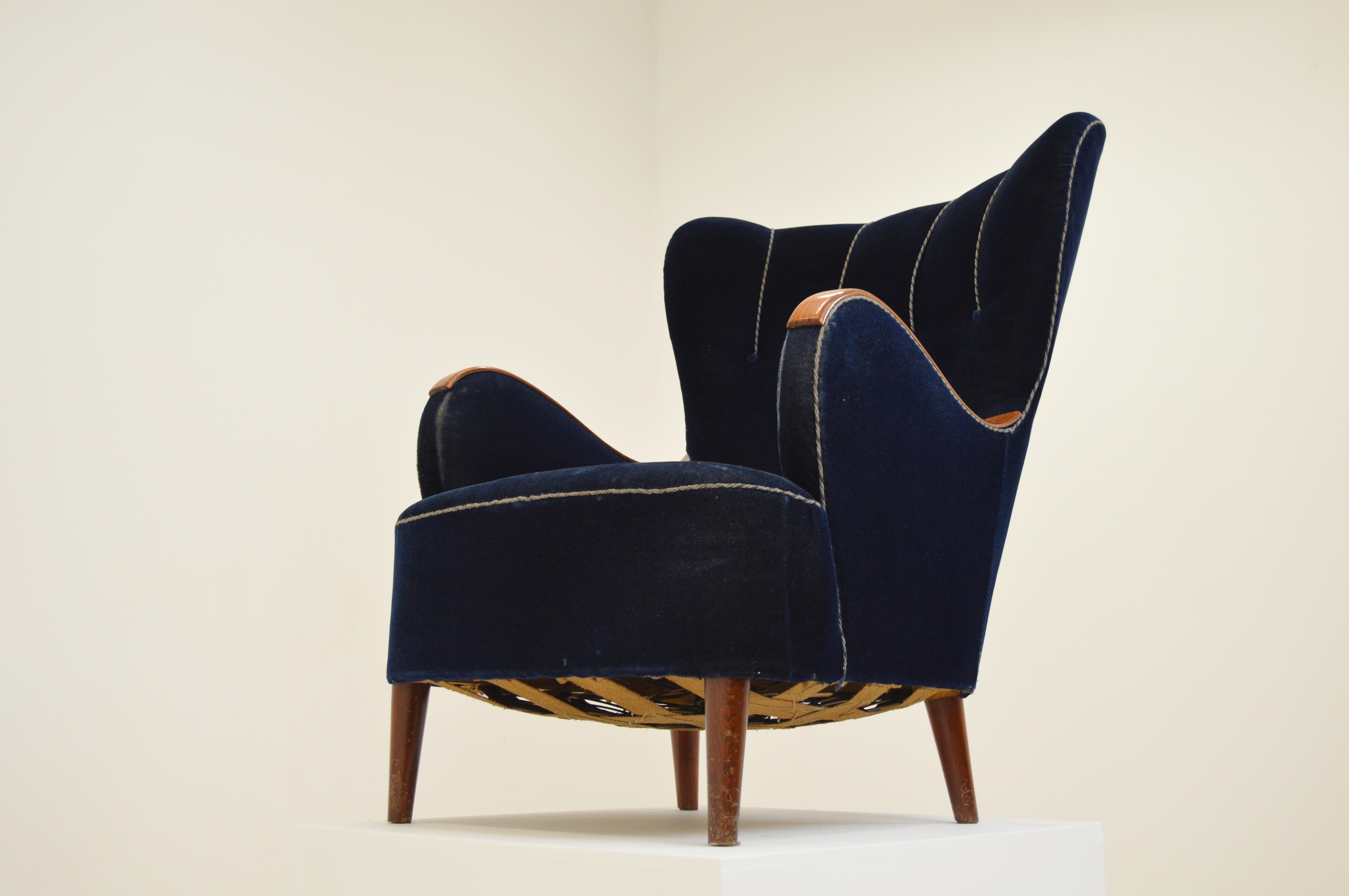 In the style of Mogens Lassen, Fritz Henningsen. Scandinavian design, unknown better manufacturer in Sweden or Denmark.

Imagine this elegant armchair in sheepskin or a high quality fabric with your favorite pattern. It has its original fabric