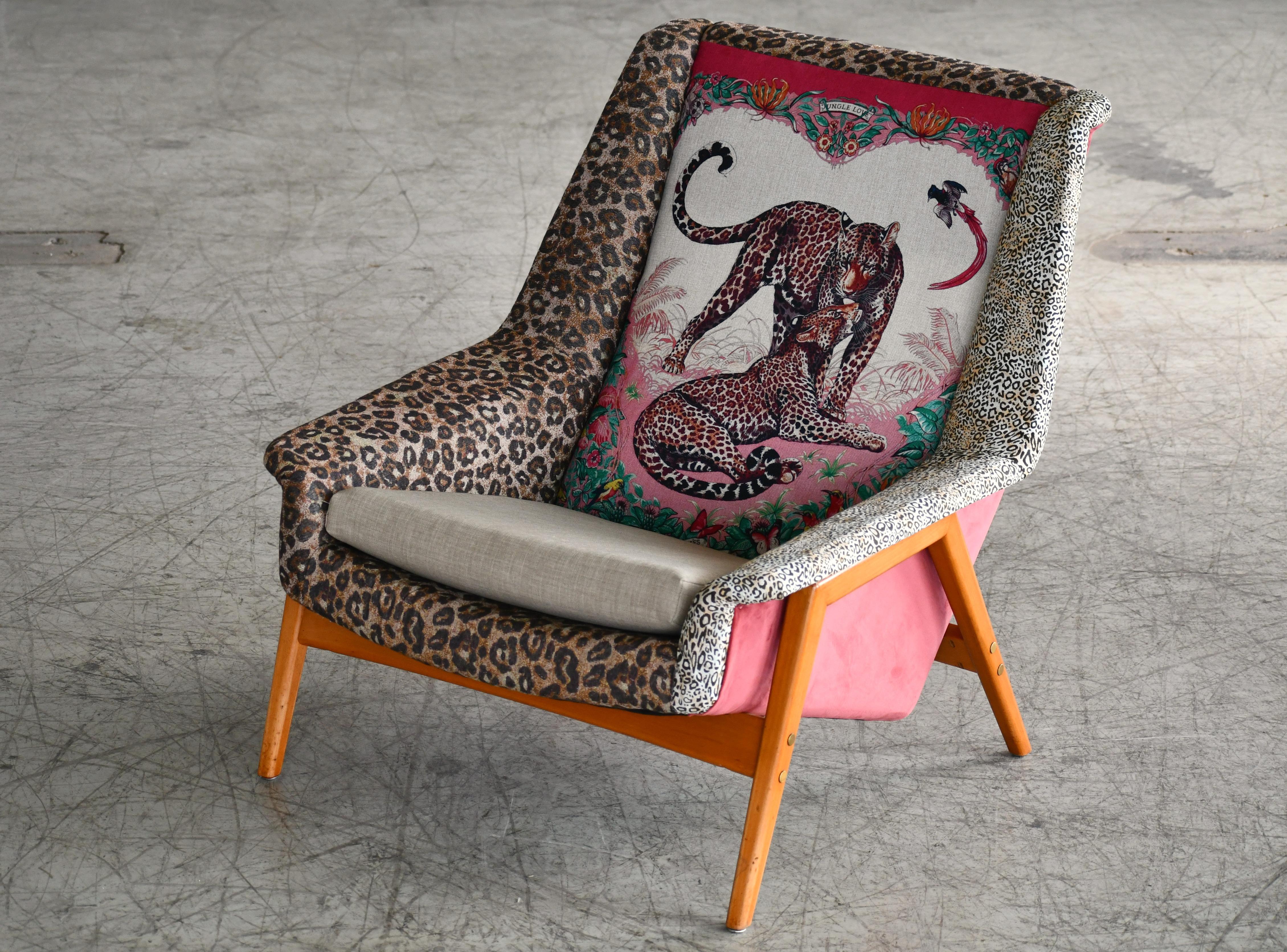 Quintessential midcentury design this lounge chair designed by Folke Ohlsson for DUX in Sweden in the 1960s turned into a true work of art with an elaborate re-upholstery job matching several jungle themed fabrics all made by Hermes. Is a true work