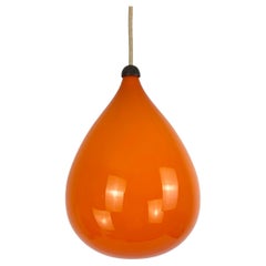 Vintage Scandinavian 1960s pendant lamp orange glass and teak Kristiansson Luxus, Sweden
